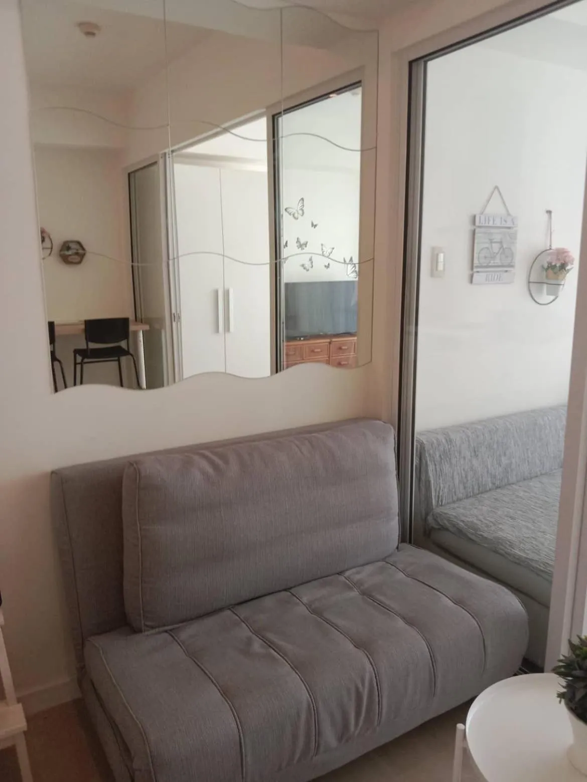 Seating area in Azure Residences by Van Florendo