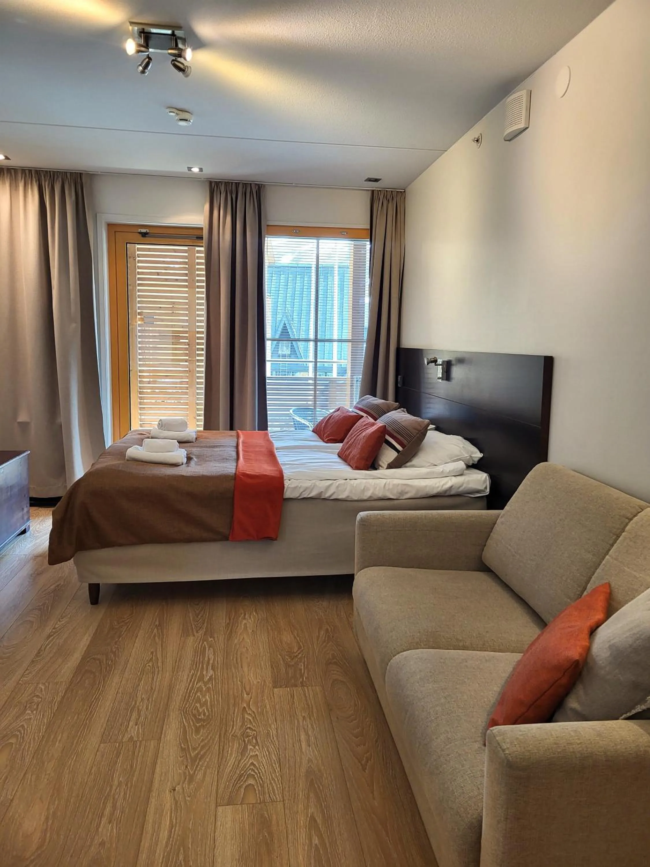 Seating area, Bed in Levi Suites Levi Gold