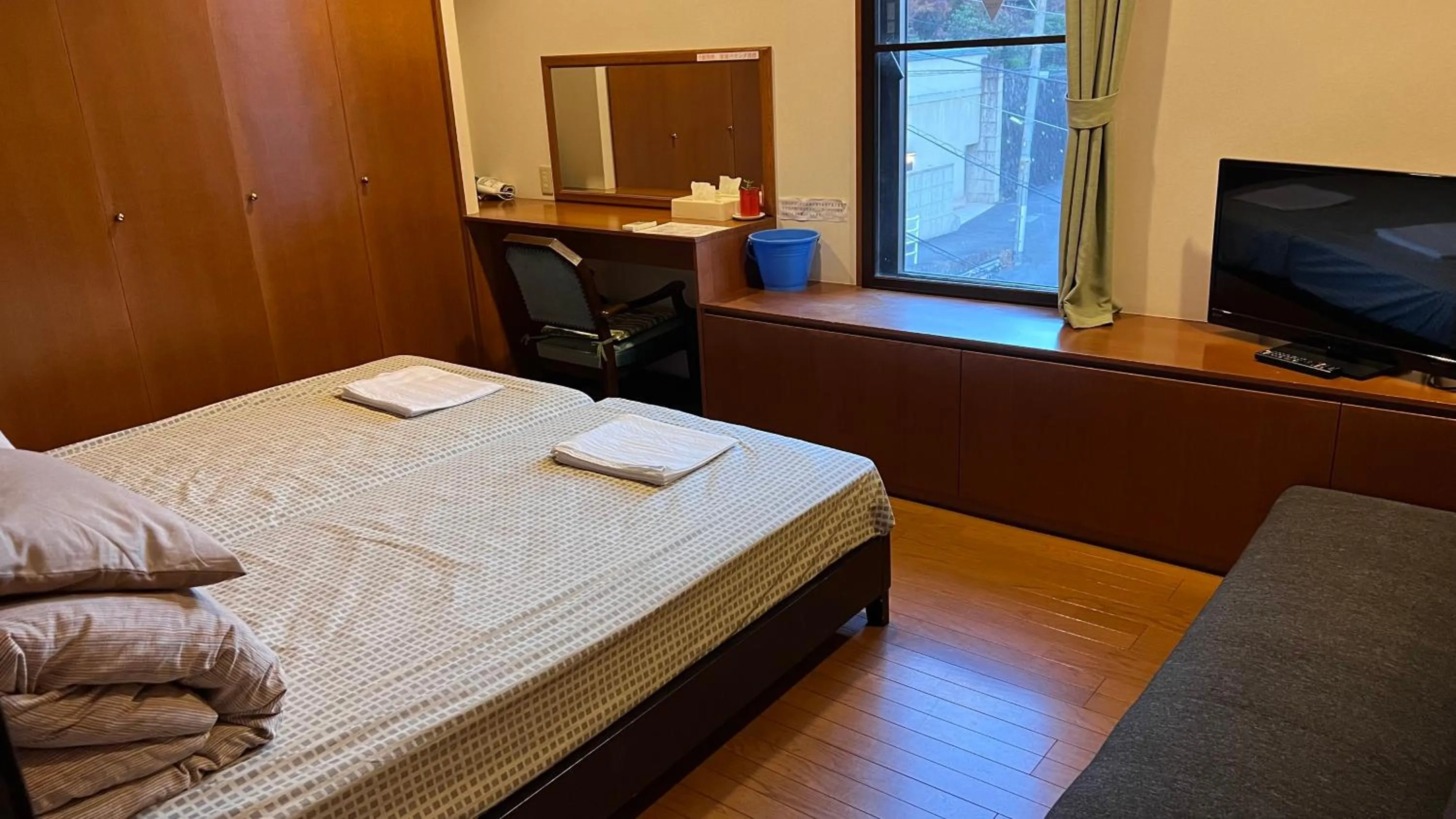 Bed in Atami Onsen Guest House Megumi 5 minutes walk from Atami Station