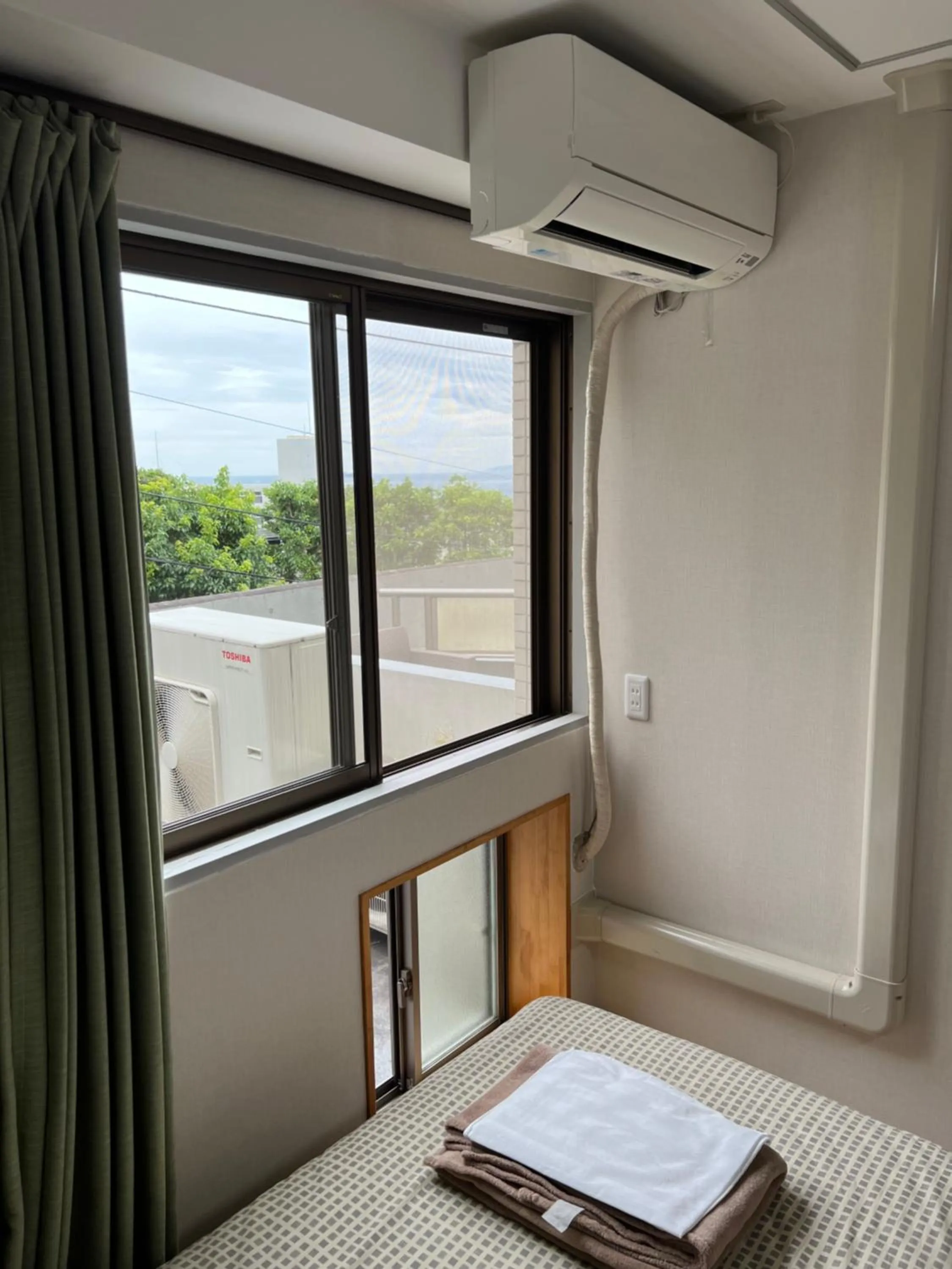 Bed in Atami Onsen Guest House Megumi 5 minutes walk from Atami Station