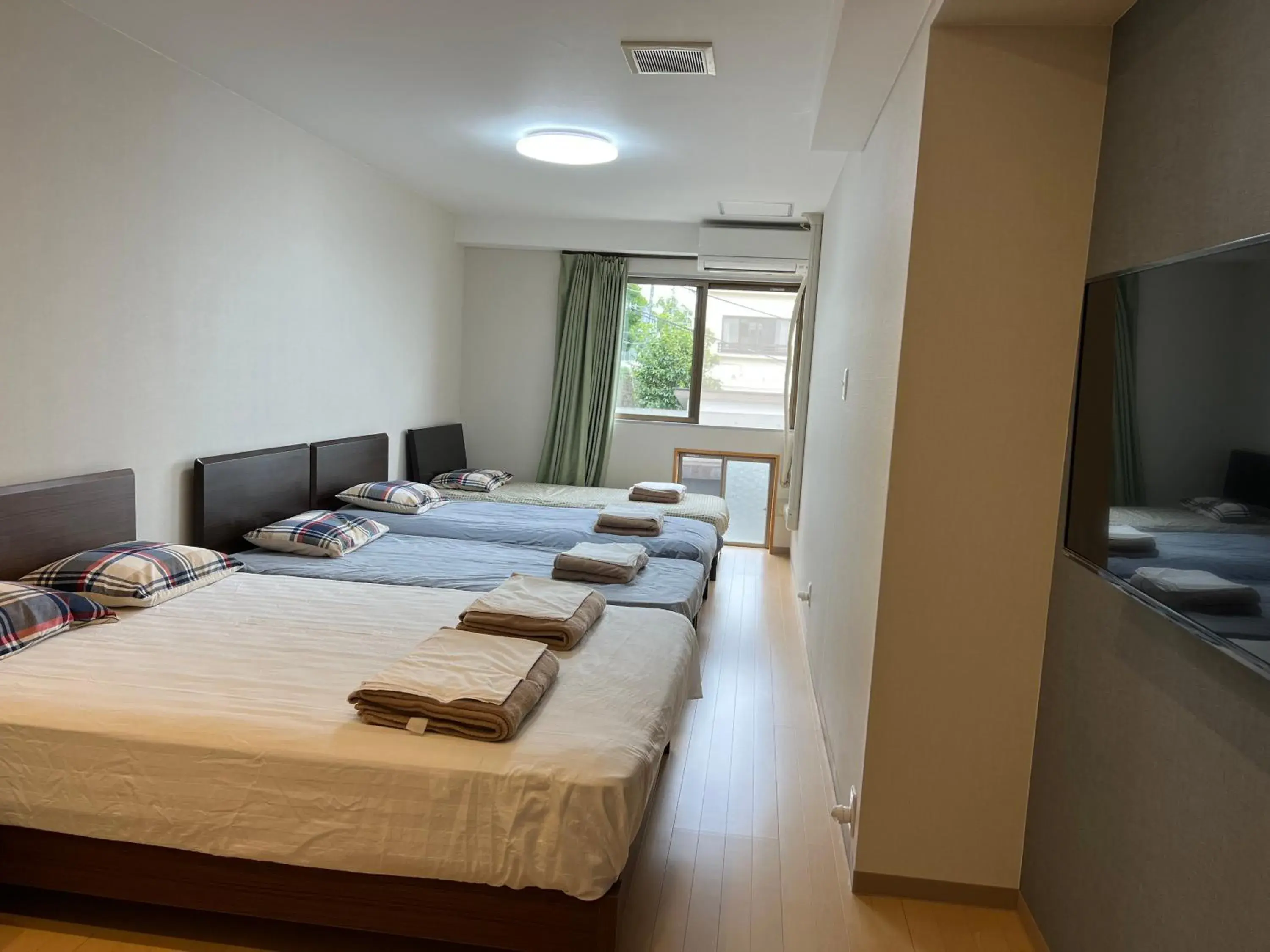Bed in Atami Onsen Guest House Megumi 5 minutes walk from Atami Station Bed in Atami Onsen Guest House Megumi 5 minutes walk from Atami Station