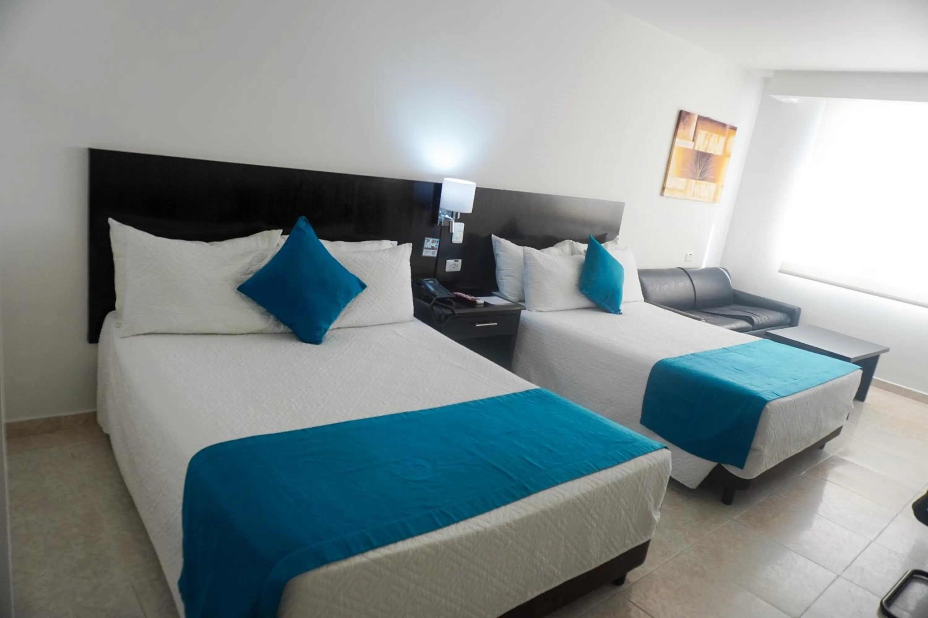 Bed in Hotel Cartagena Plaza