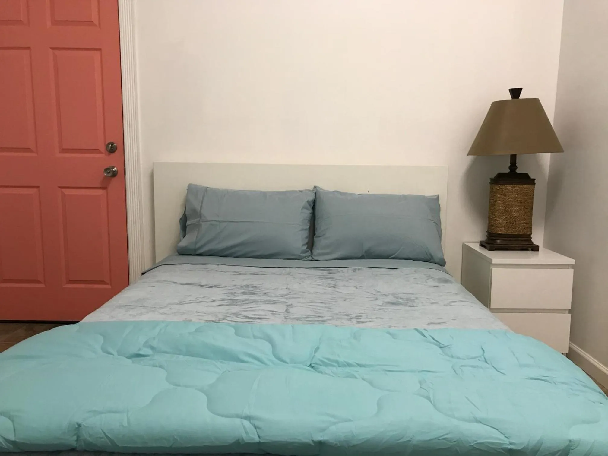 Bed in Aquamarine Suites