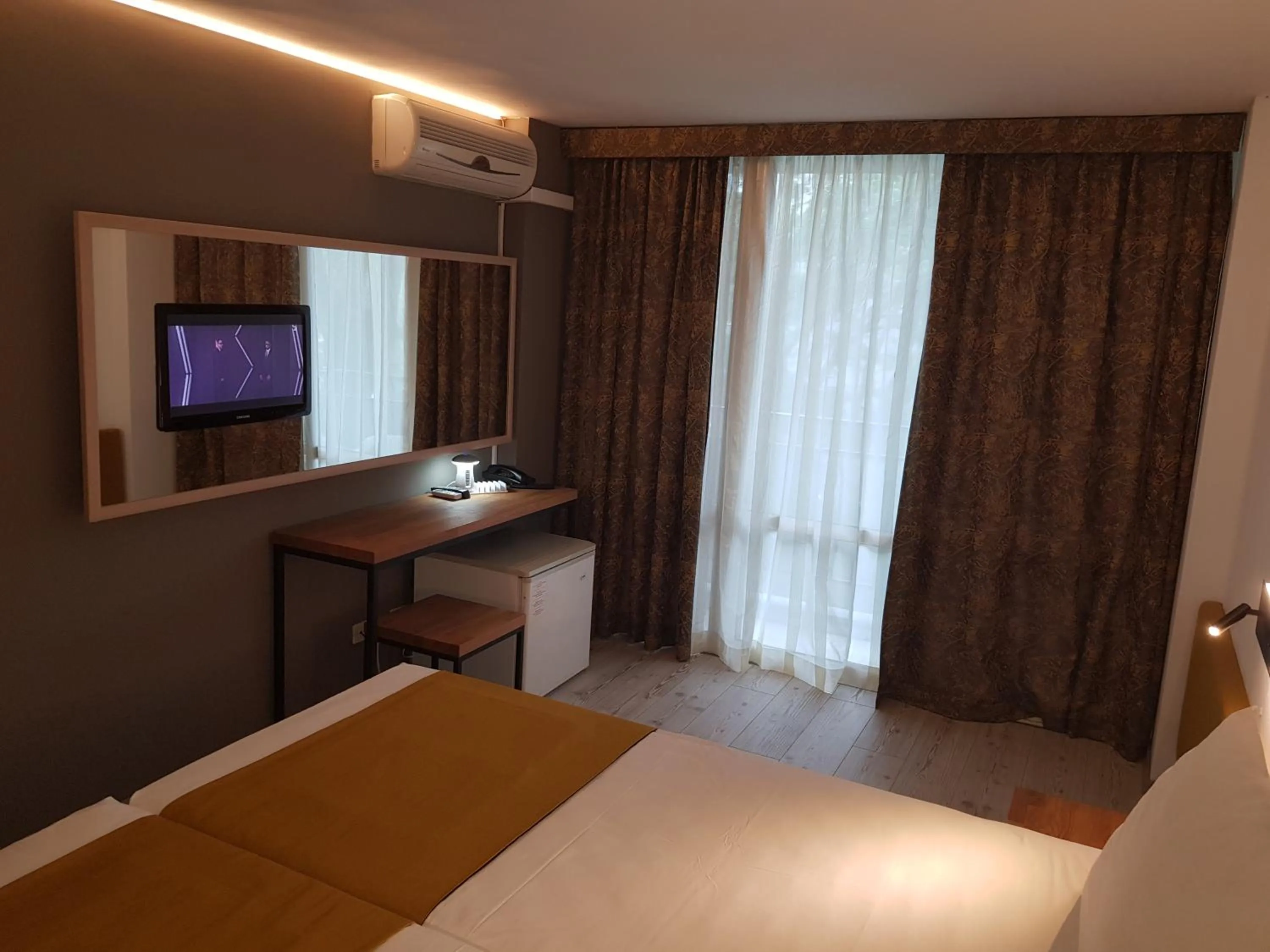 Bed in Tintyava Park Hotel