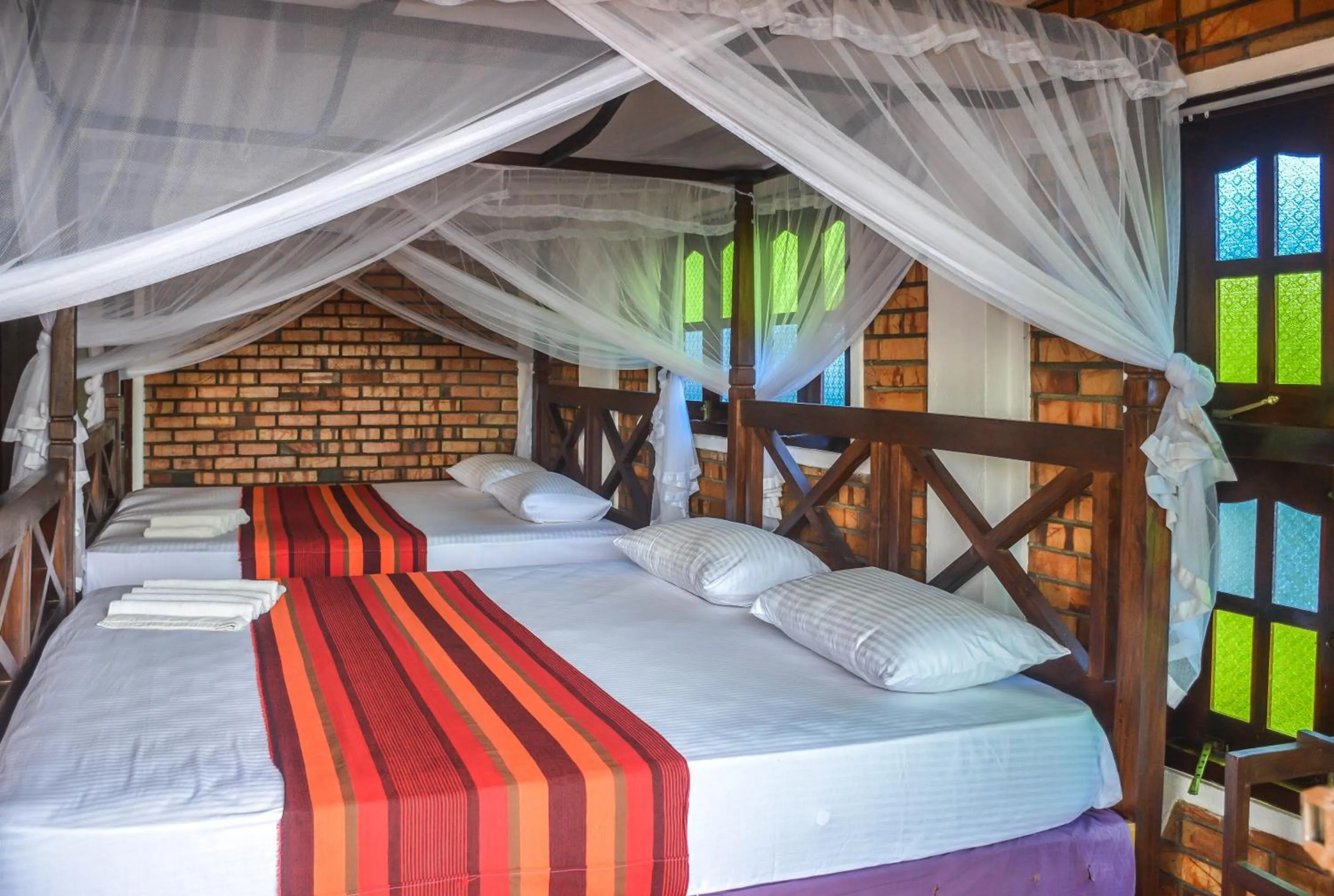 Bed in Blue Horizon Beach Hotel