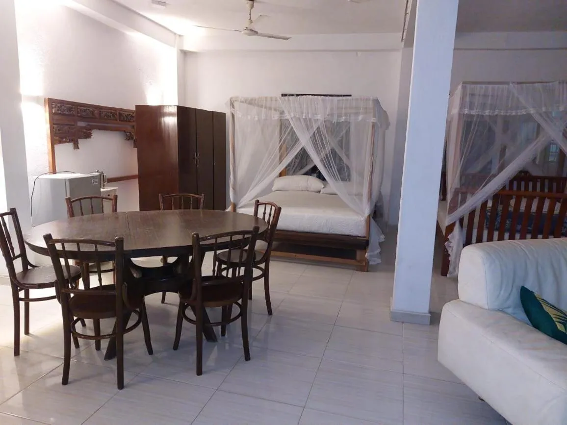 Bed in Blue Horizon Beach Hotel