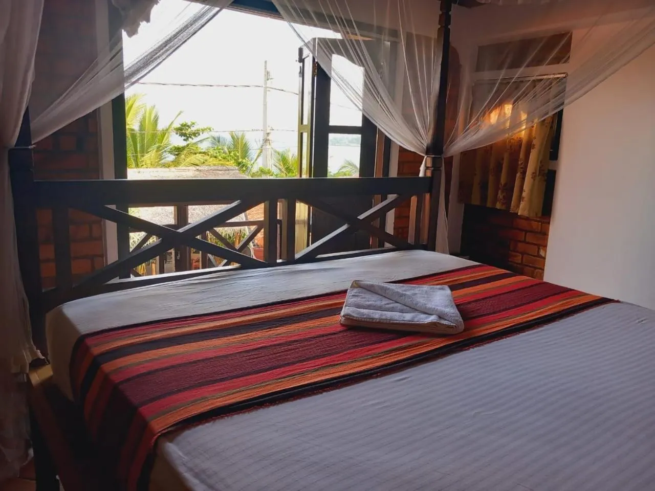 Bed in Blue Horizon Beach Hotel