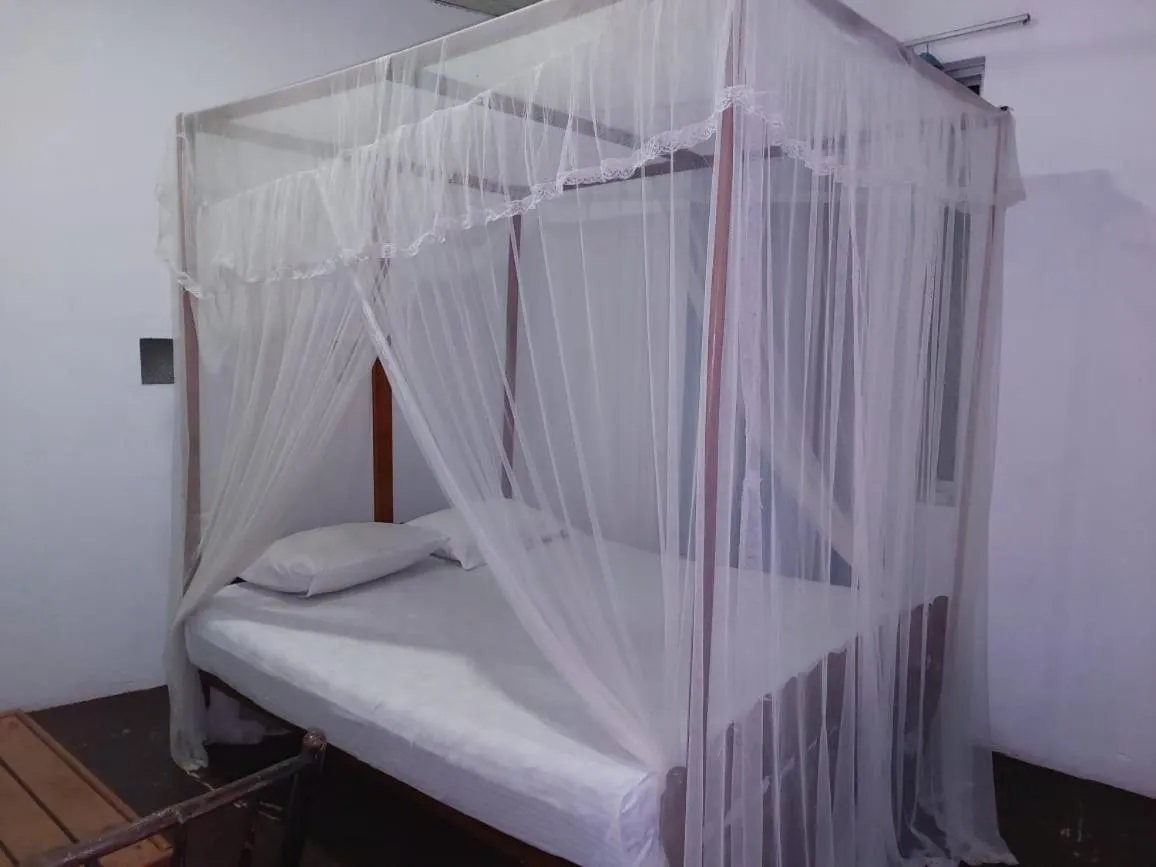 Bed in Blue Horizon Beach Hotel