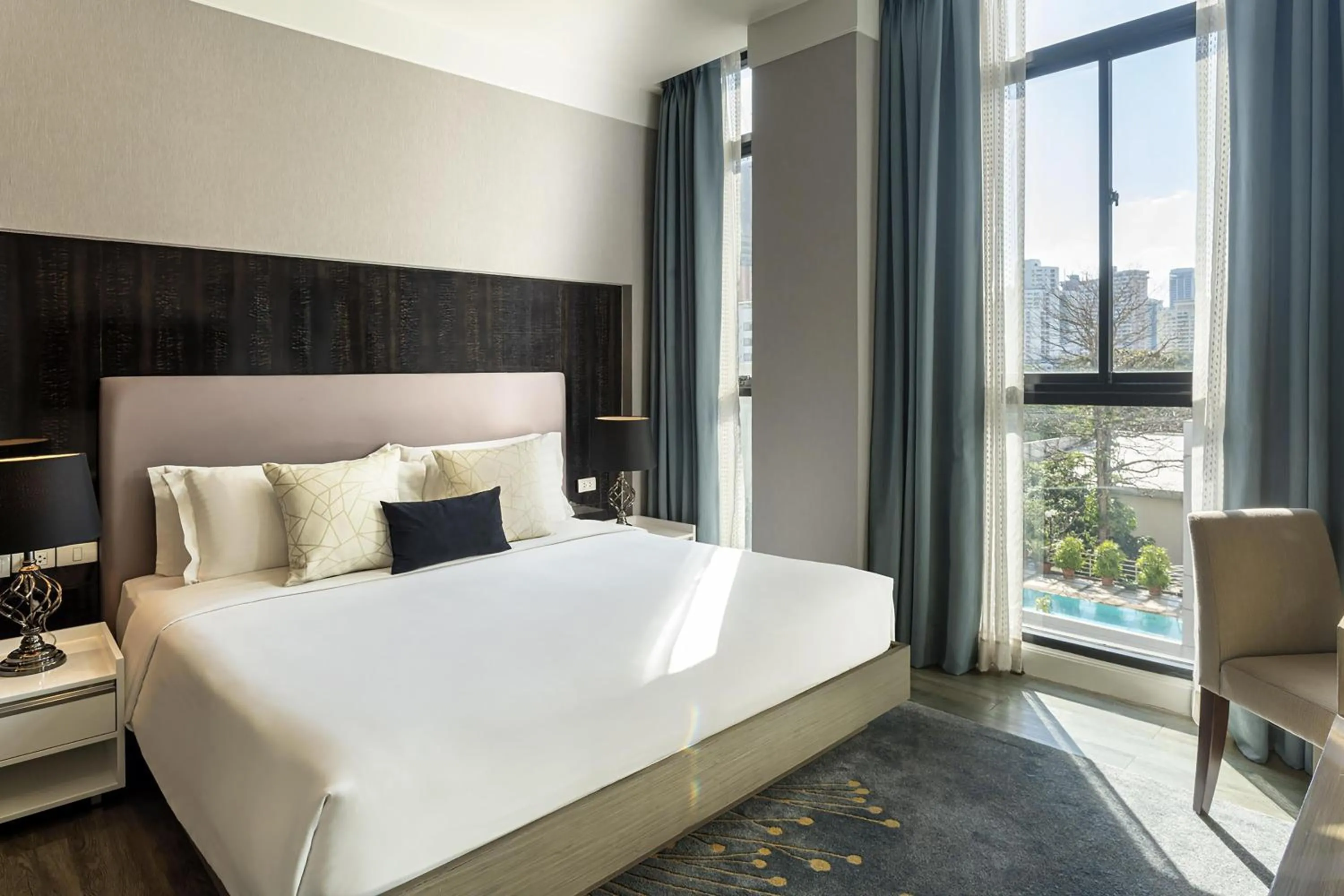 Bed in Metropolis Suites Bangkok, Tapestry Collection by Hilton