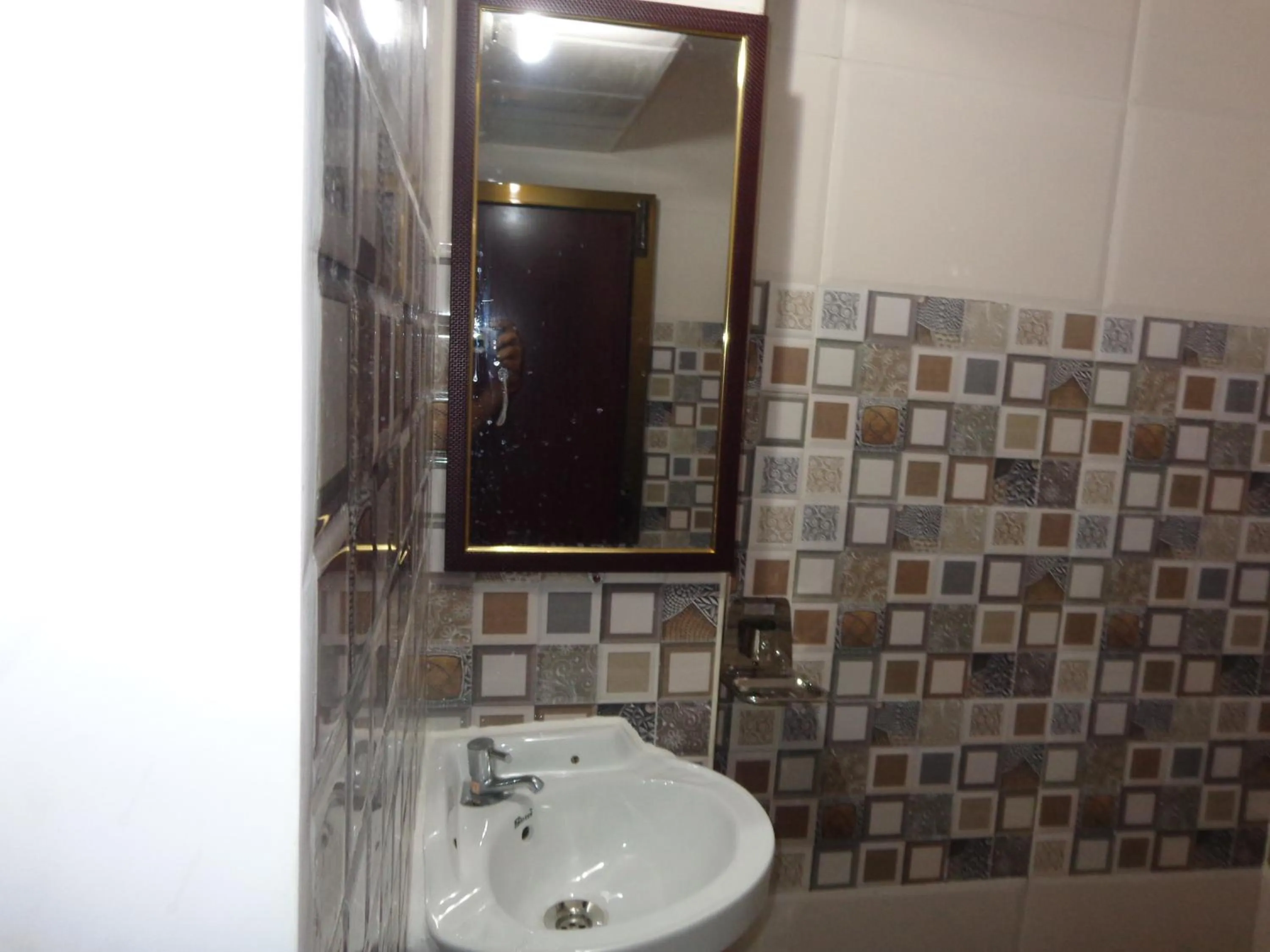 Bathroom in Luxmi Hotel