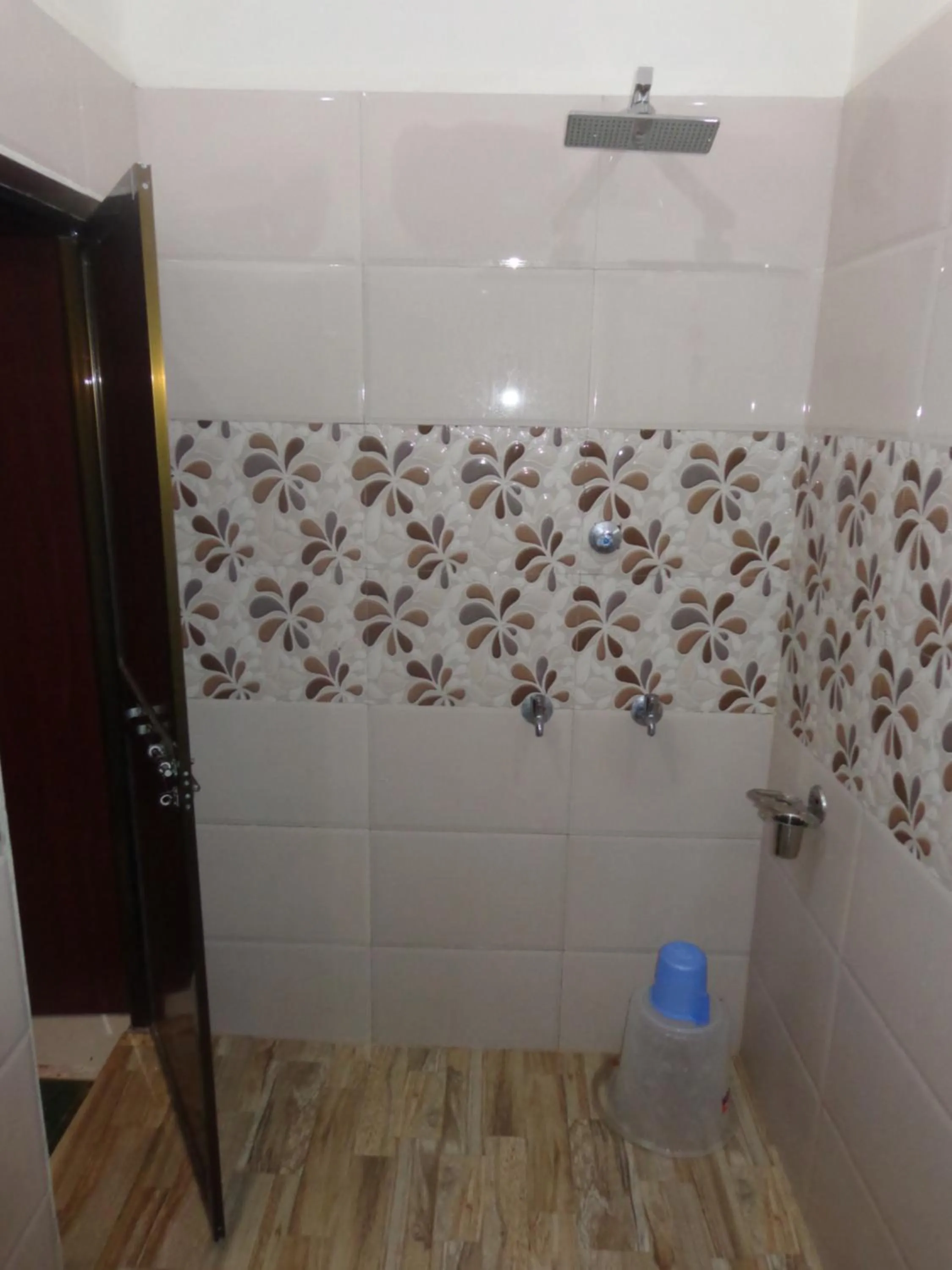 Bathroom in Luxmi Hotel