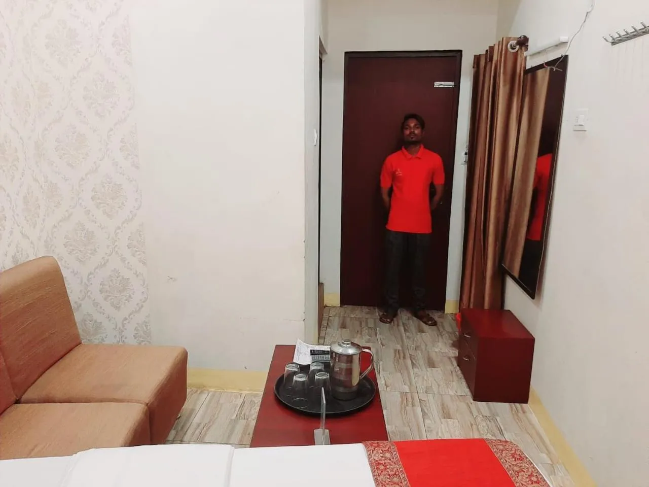 Living room, Bed in Luxmi Hotel