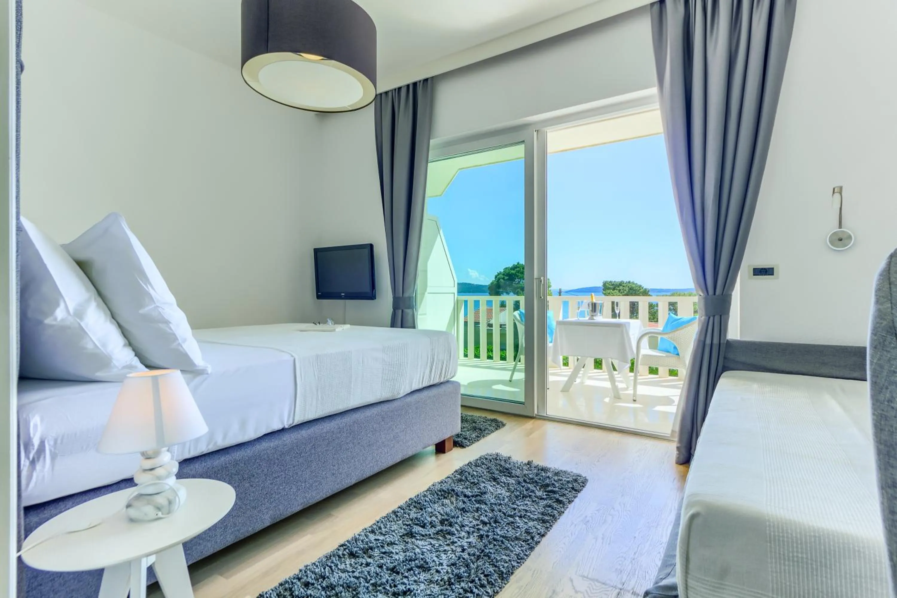 Bed in Hotel Riva Kaštela with swimming pool