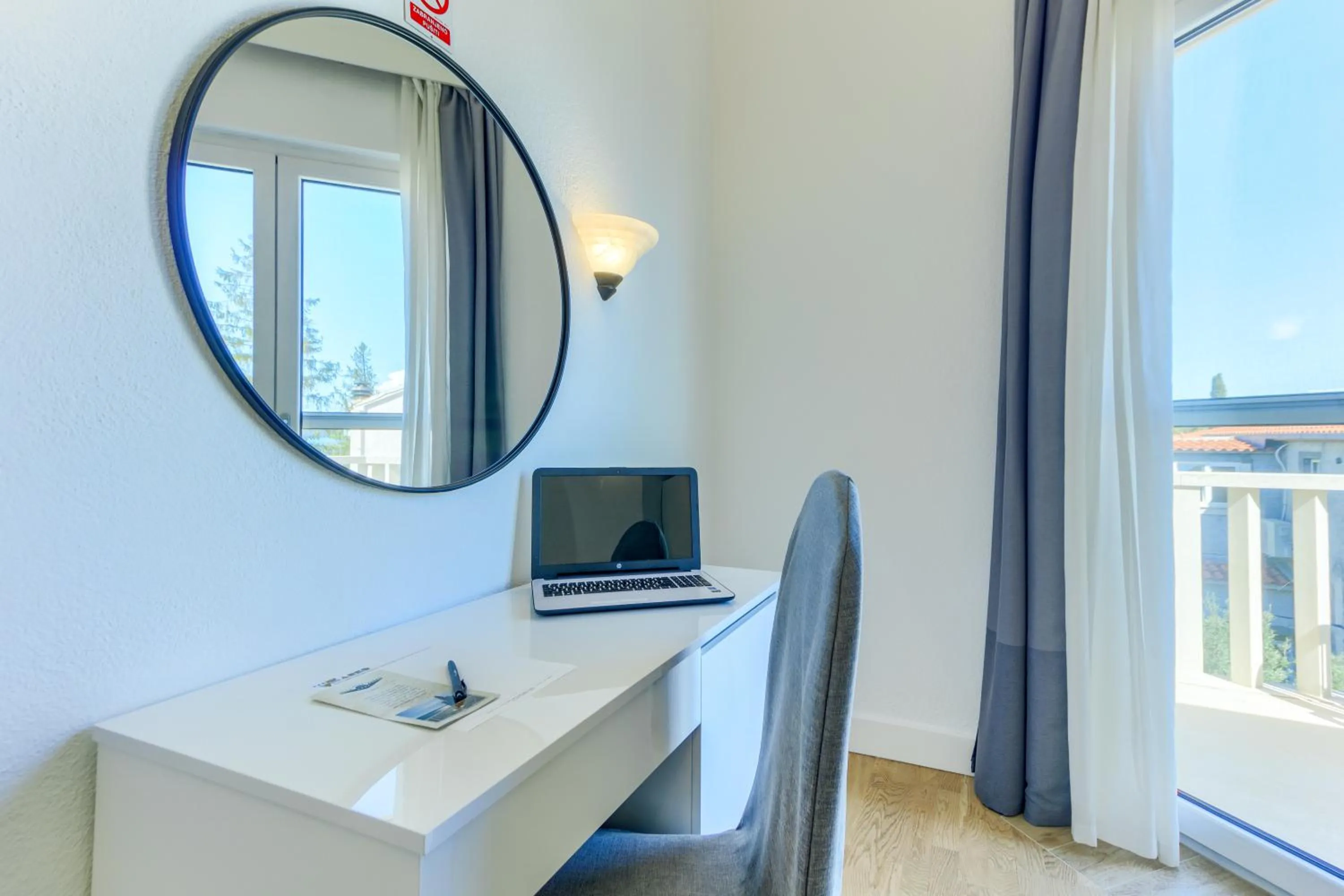Seating area in Hotel Riva Kaštela with swimming pool