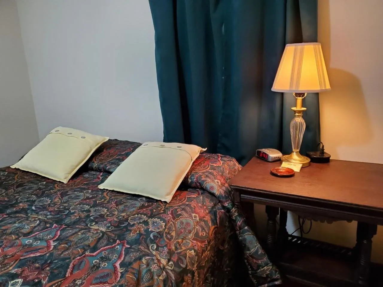 Bed in Little River Inn Motel