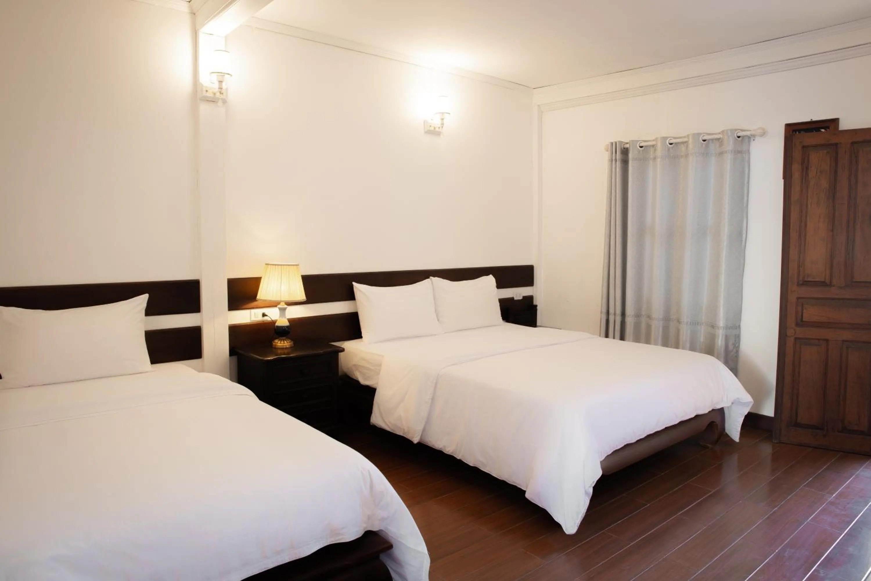 Bed in Villa Senesouk Luang Prabang