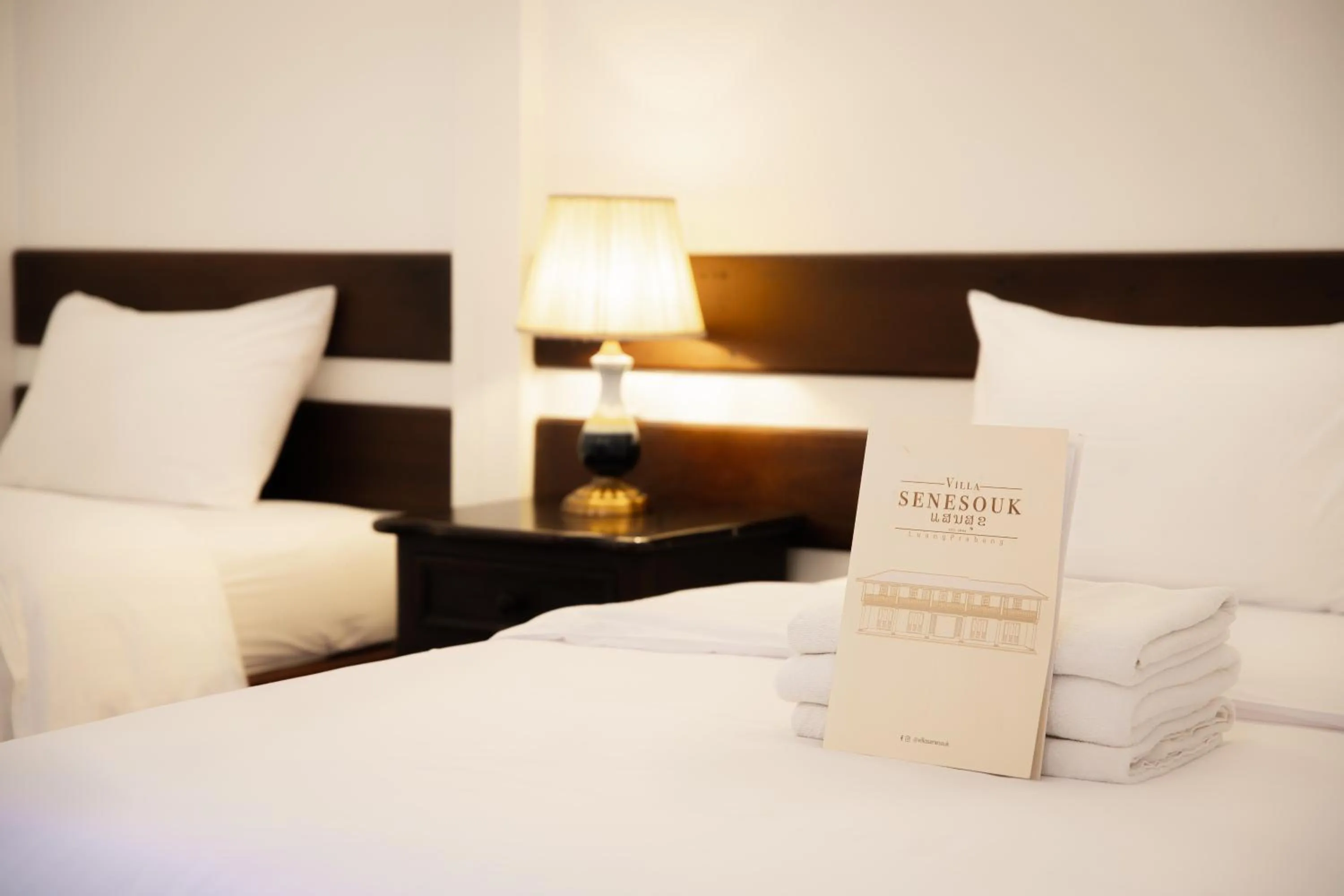 Bed in Villa Senesouk Luang Prabang