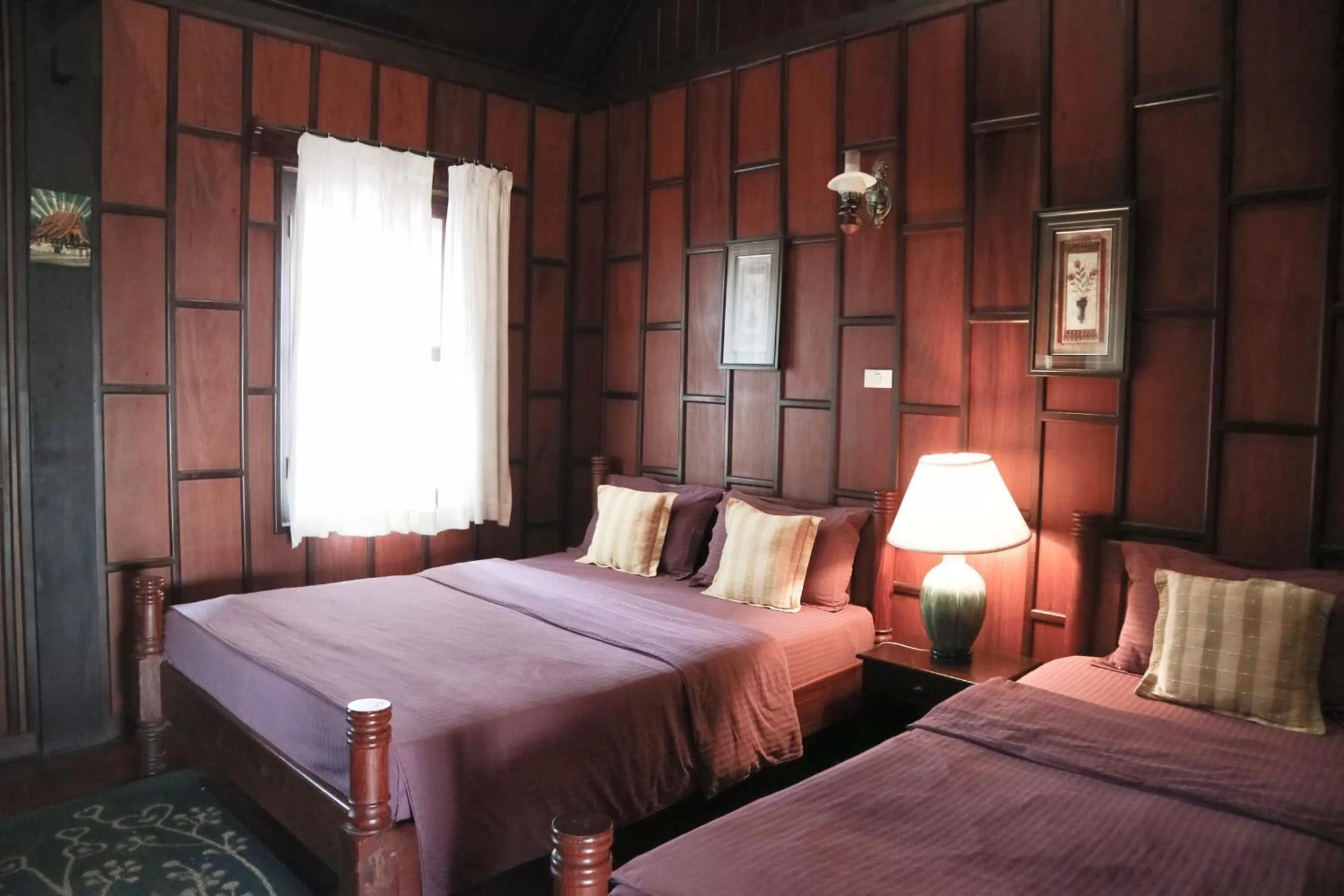 Bed in Villa Senesouk Luang Prabang