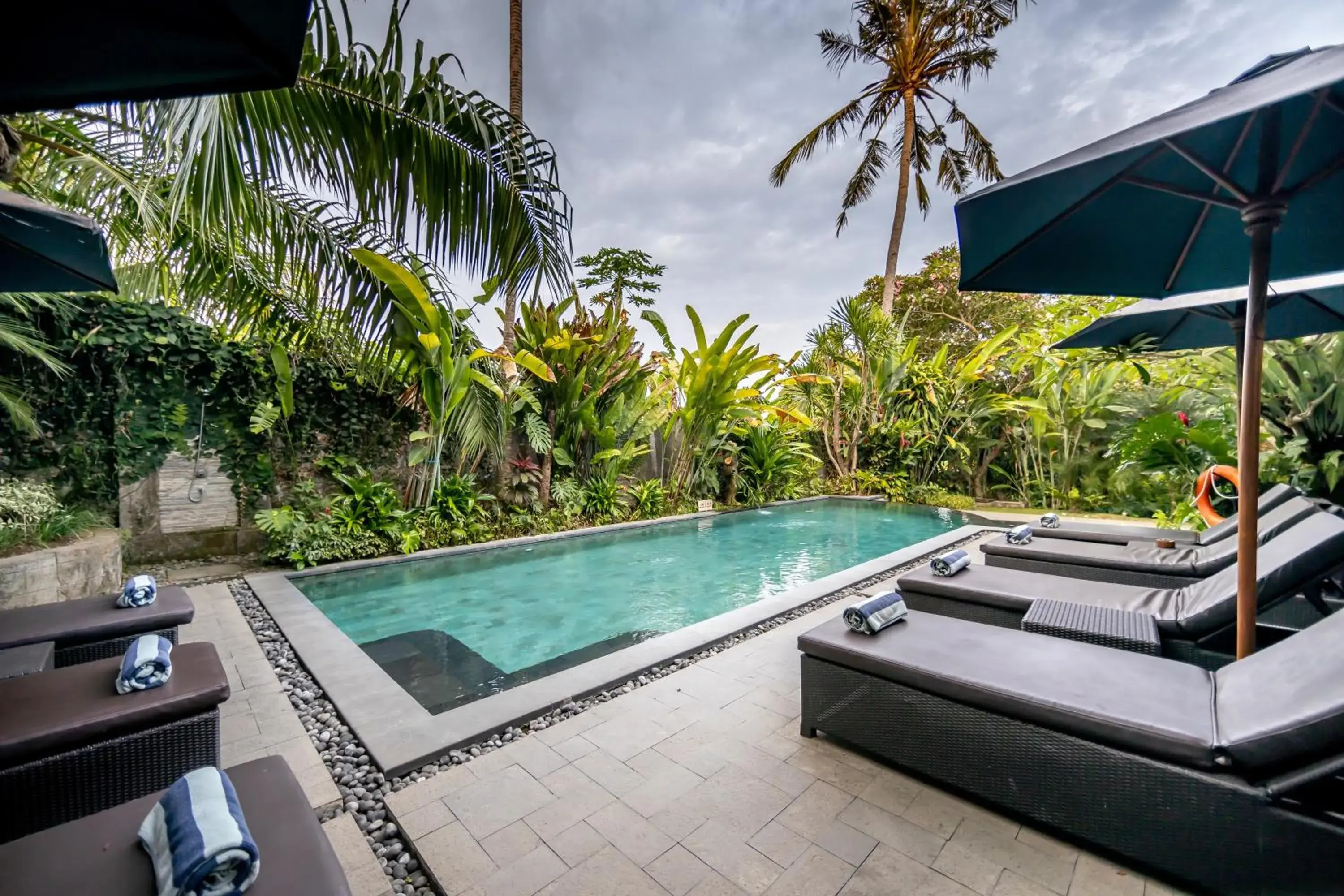 Swimming pool in De Munut Balinese Resort Swimming pool in De Munut Balinese Resort