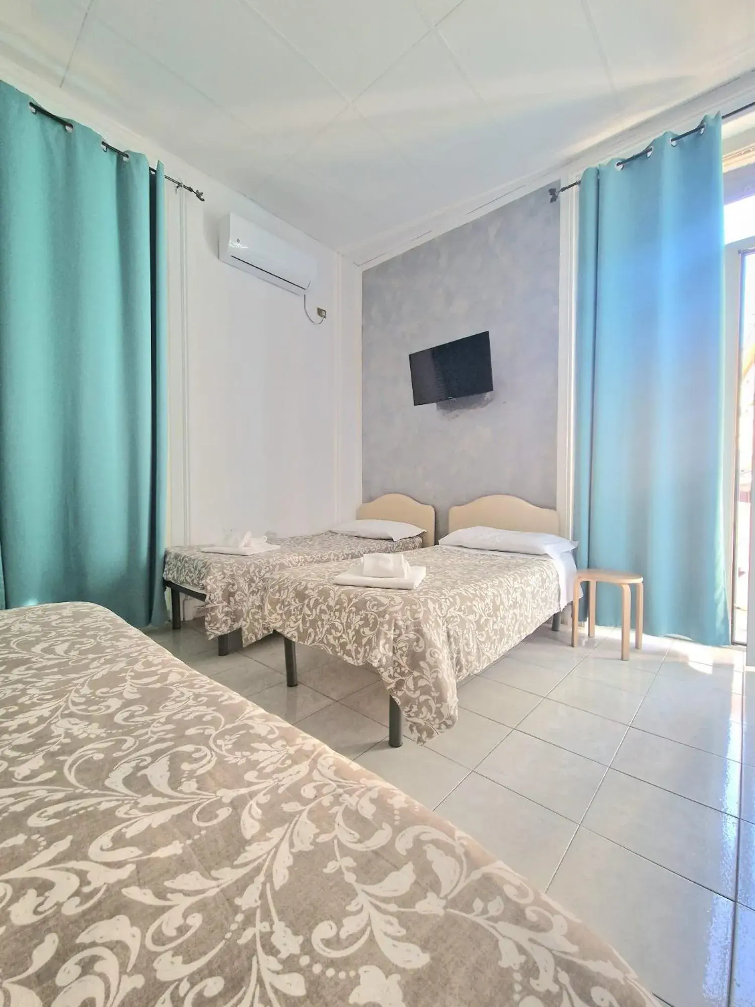 Quadruple Room in Hotel Le Orchidee Quadruple Room in Hotel Le Orchidee