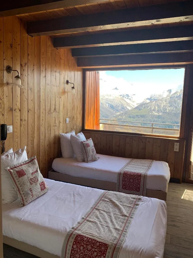Bed in Hotels Les Catrems & Le Montagnou