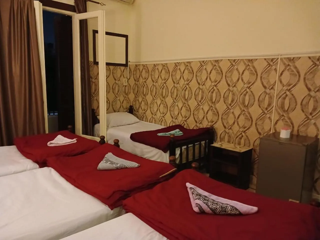 Bed in New Palace Hotel