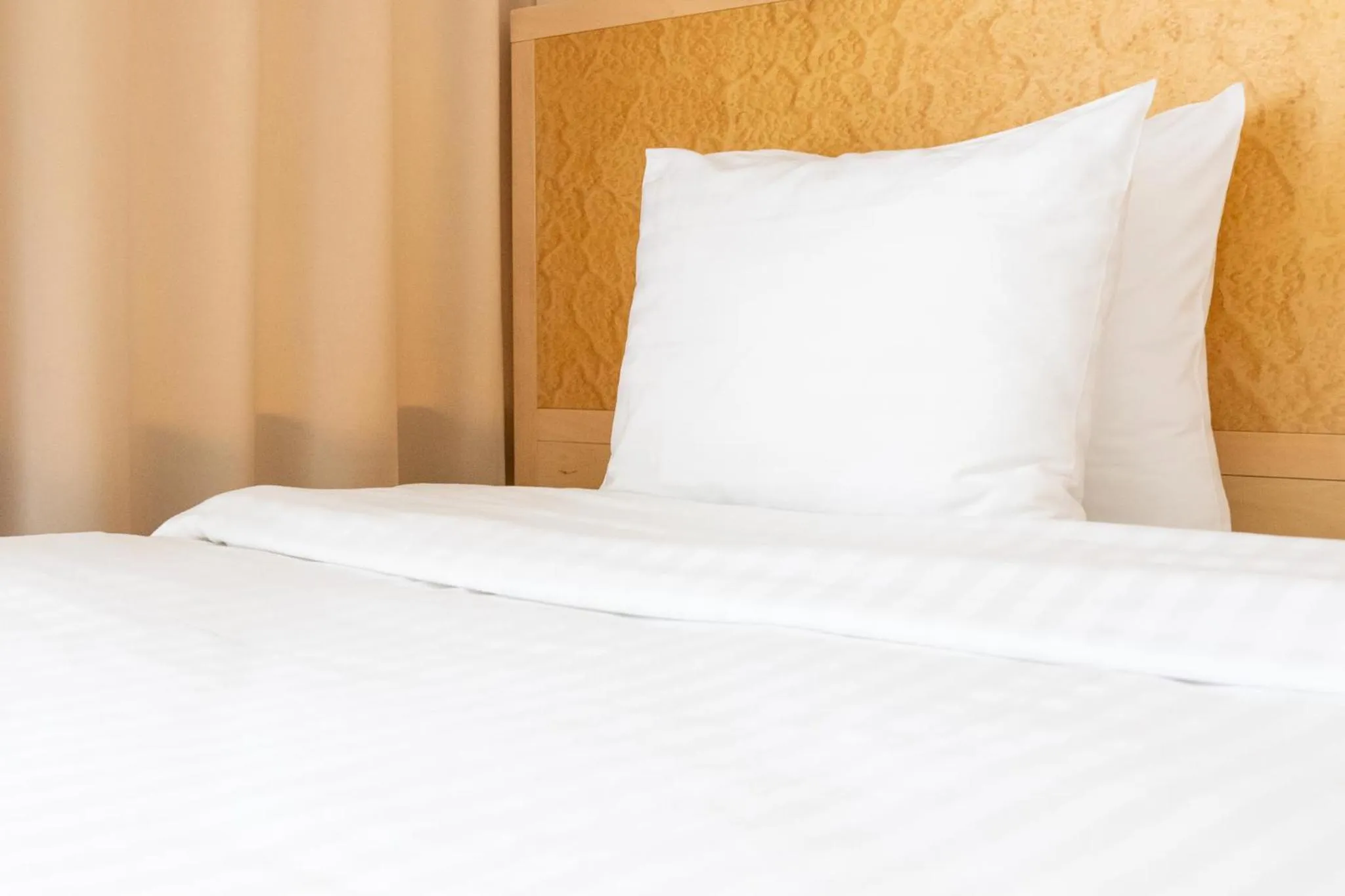 Bed in Hotel Kolumbs