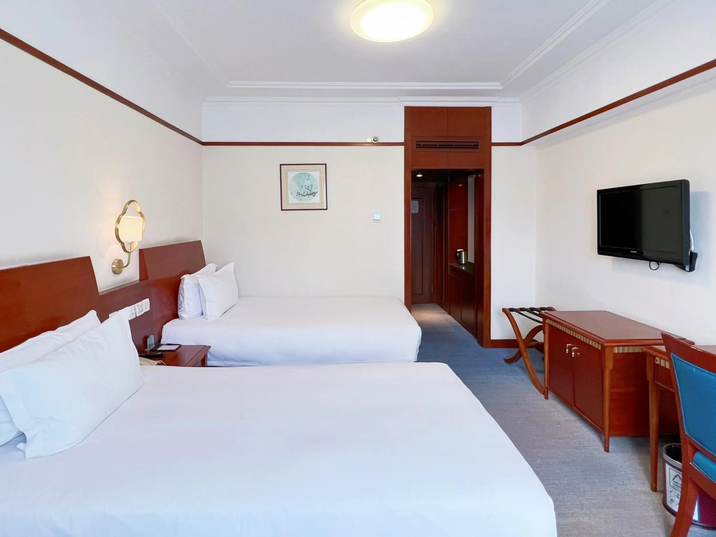 Bed in Hangzhou Xinqiao Hotel