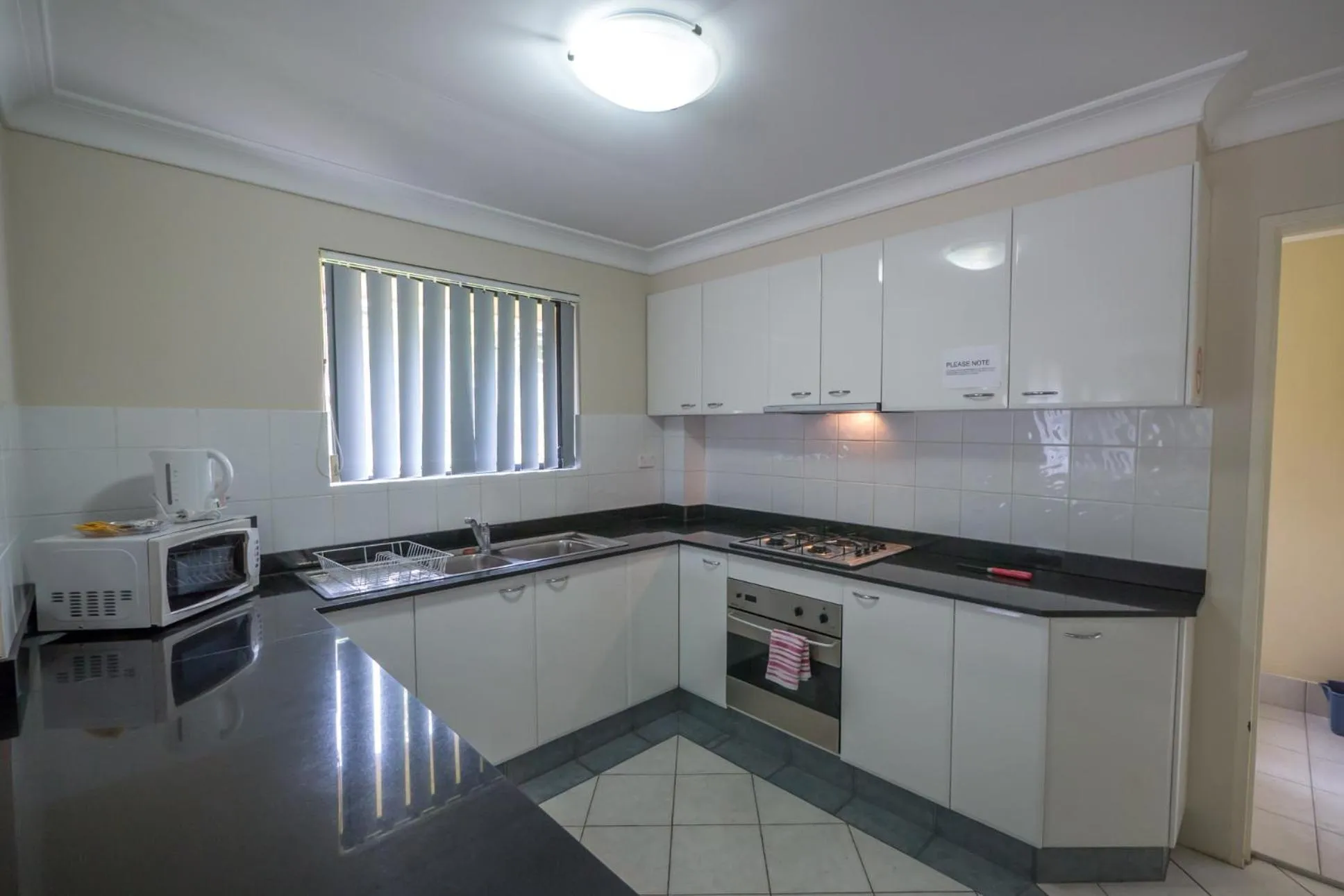 Kitchen or kitchenette in Parkside Apartments Parramatta