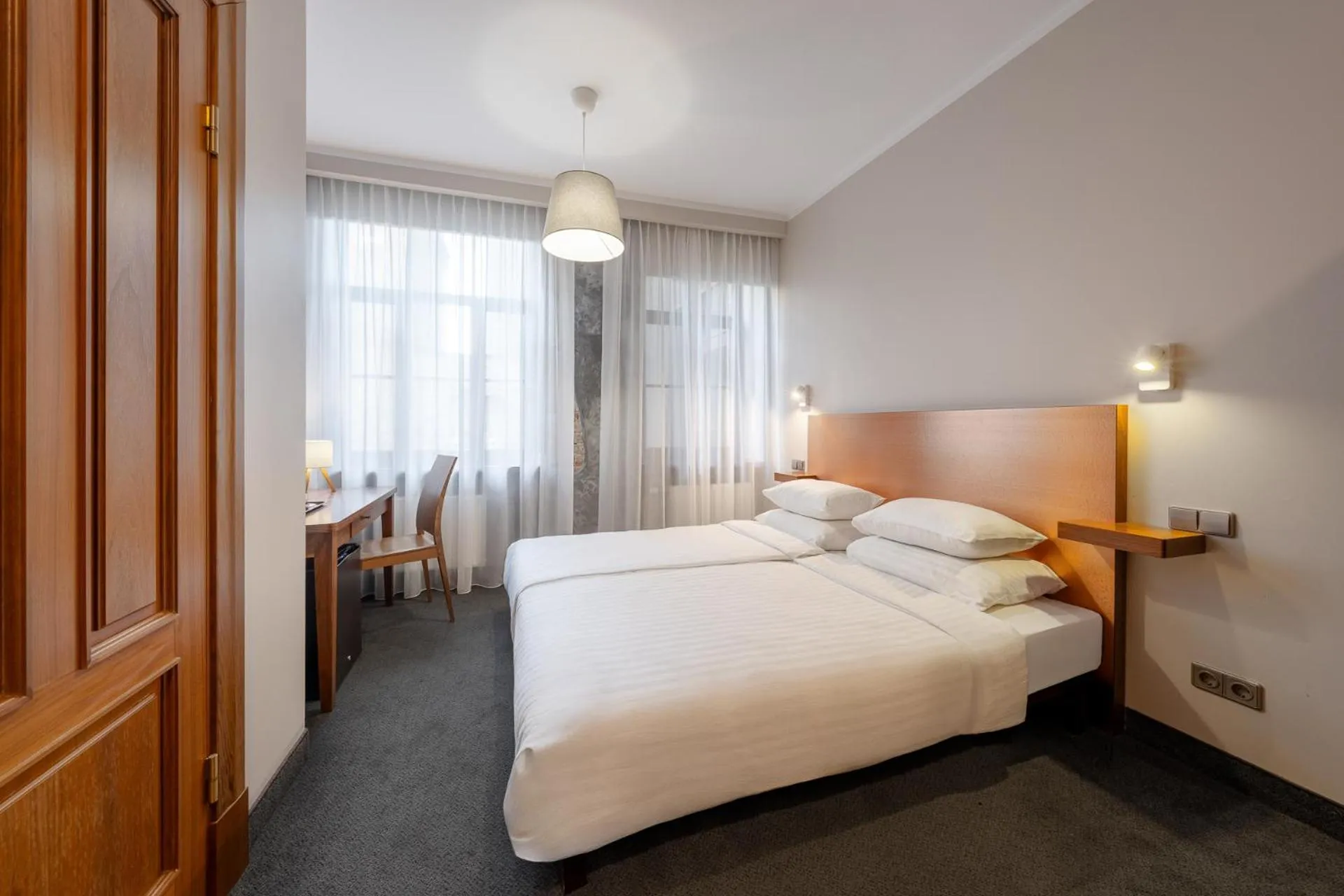 Bed in RIJA Riga City Centre Hotel
