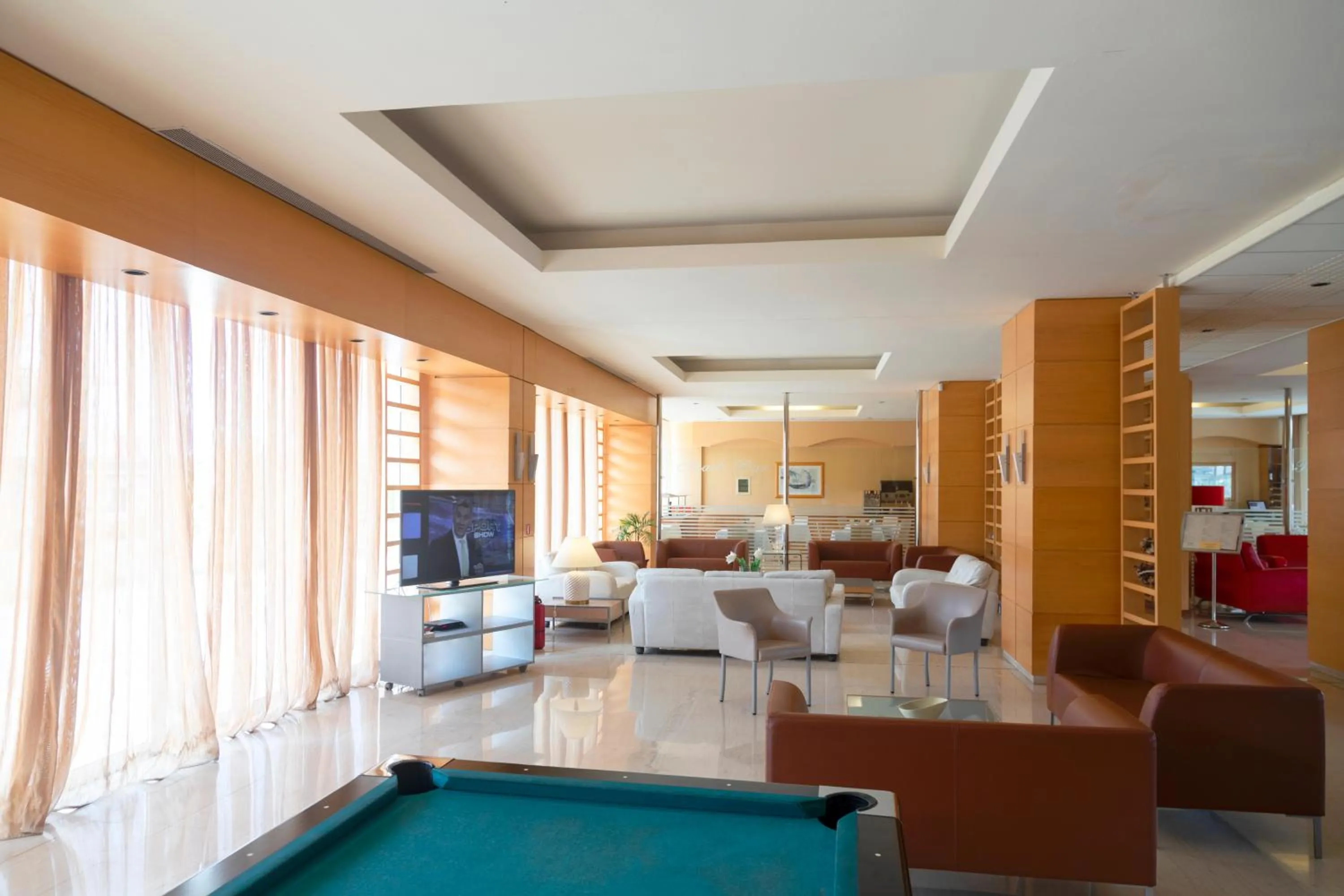 Communal lounge/ TV room in Athineon Hotel