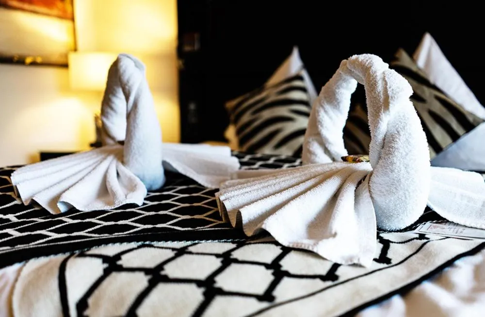 Bed in Kurhaus Design Boutique Hotel