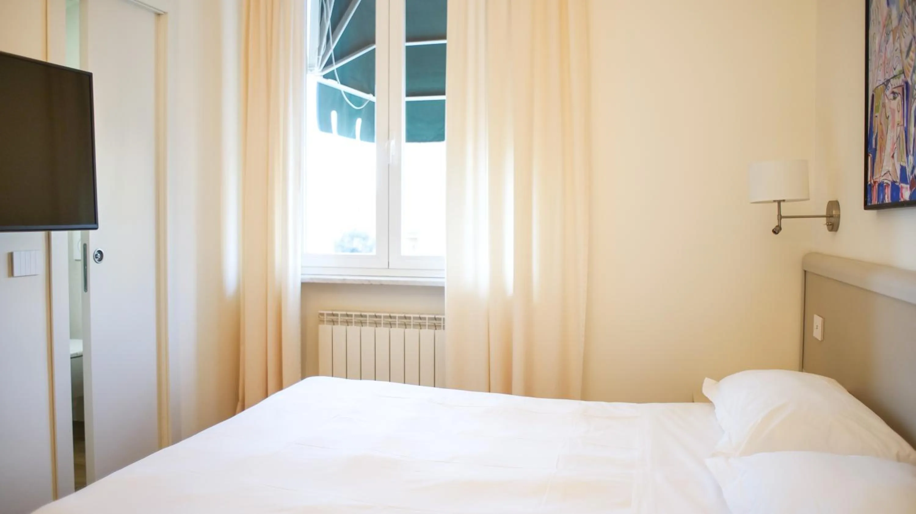 Bed in Rex Hotel Residence