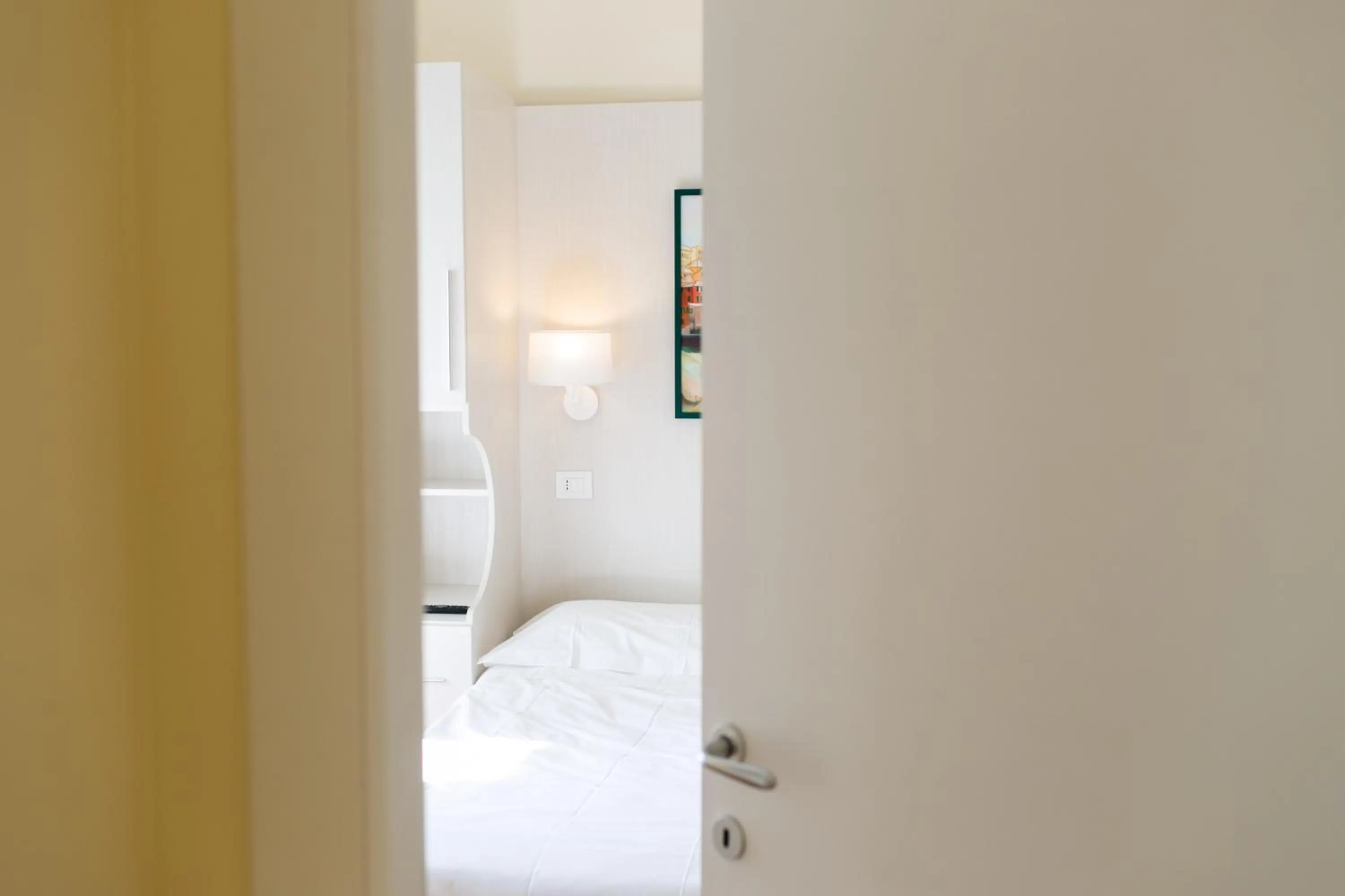 Bed in Rex Hotel Residence