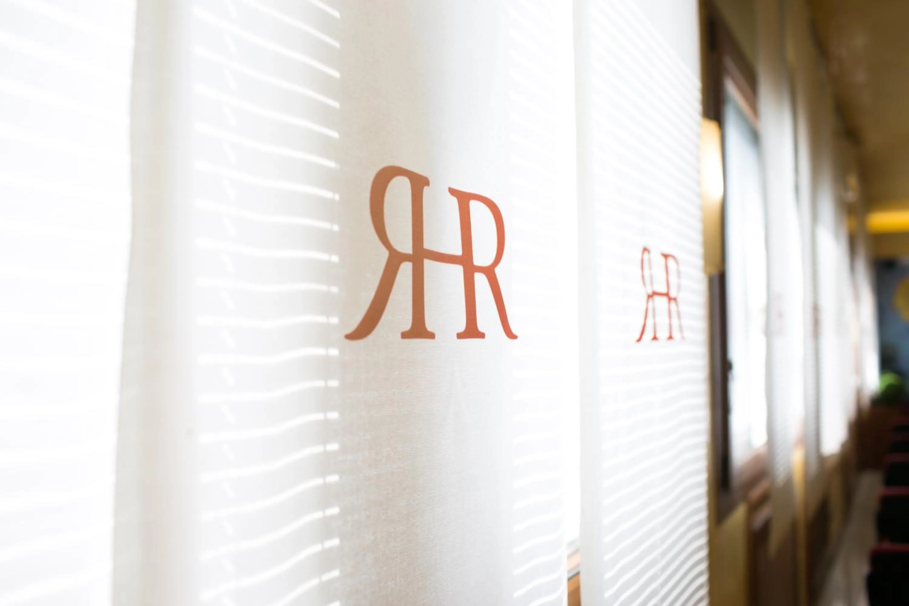 Property logo or sign in Rex Hotel Residence