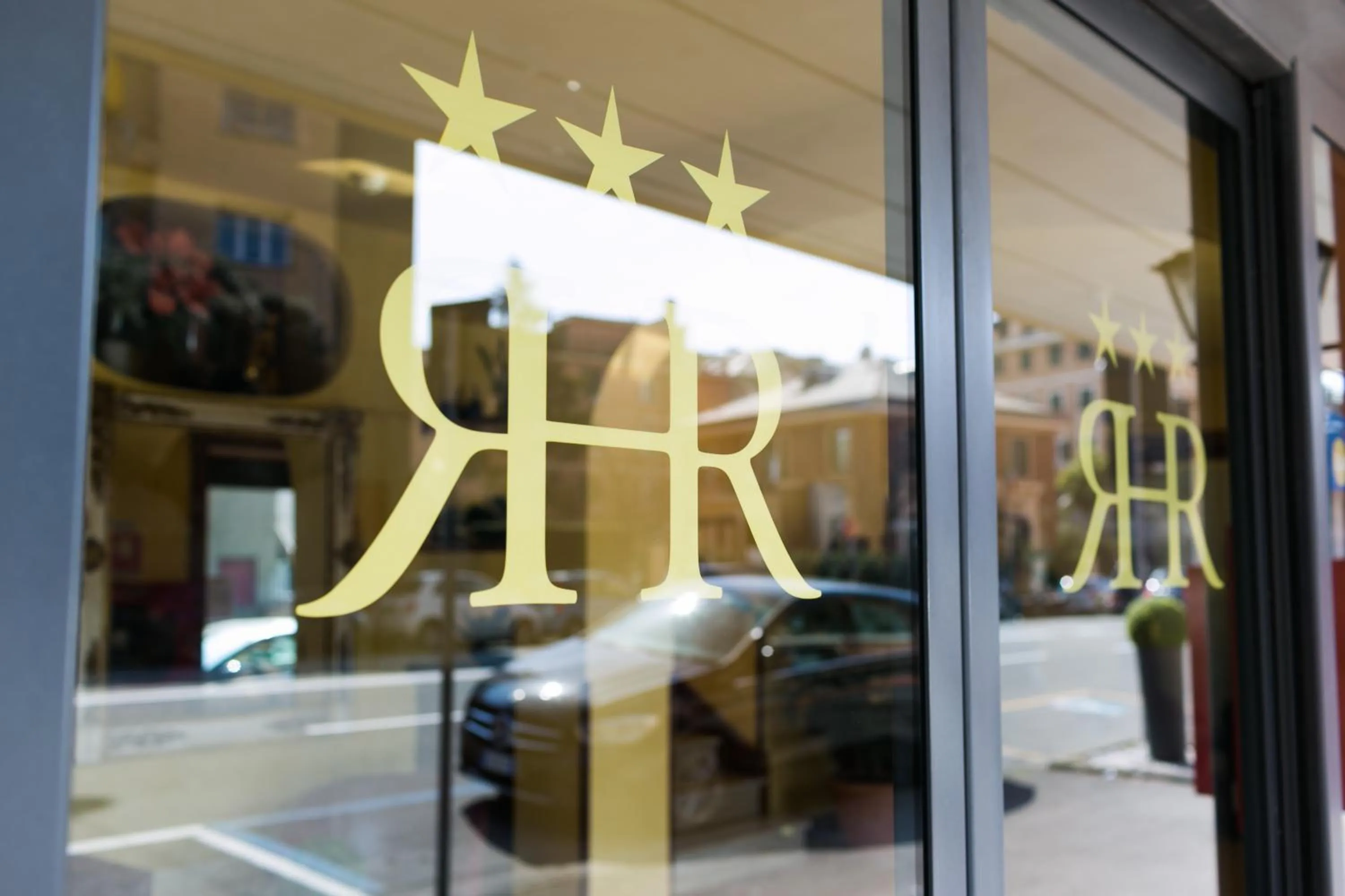 Property logo or sign in Rex Hotel Residence