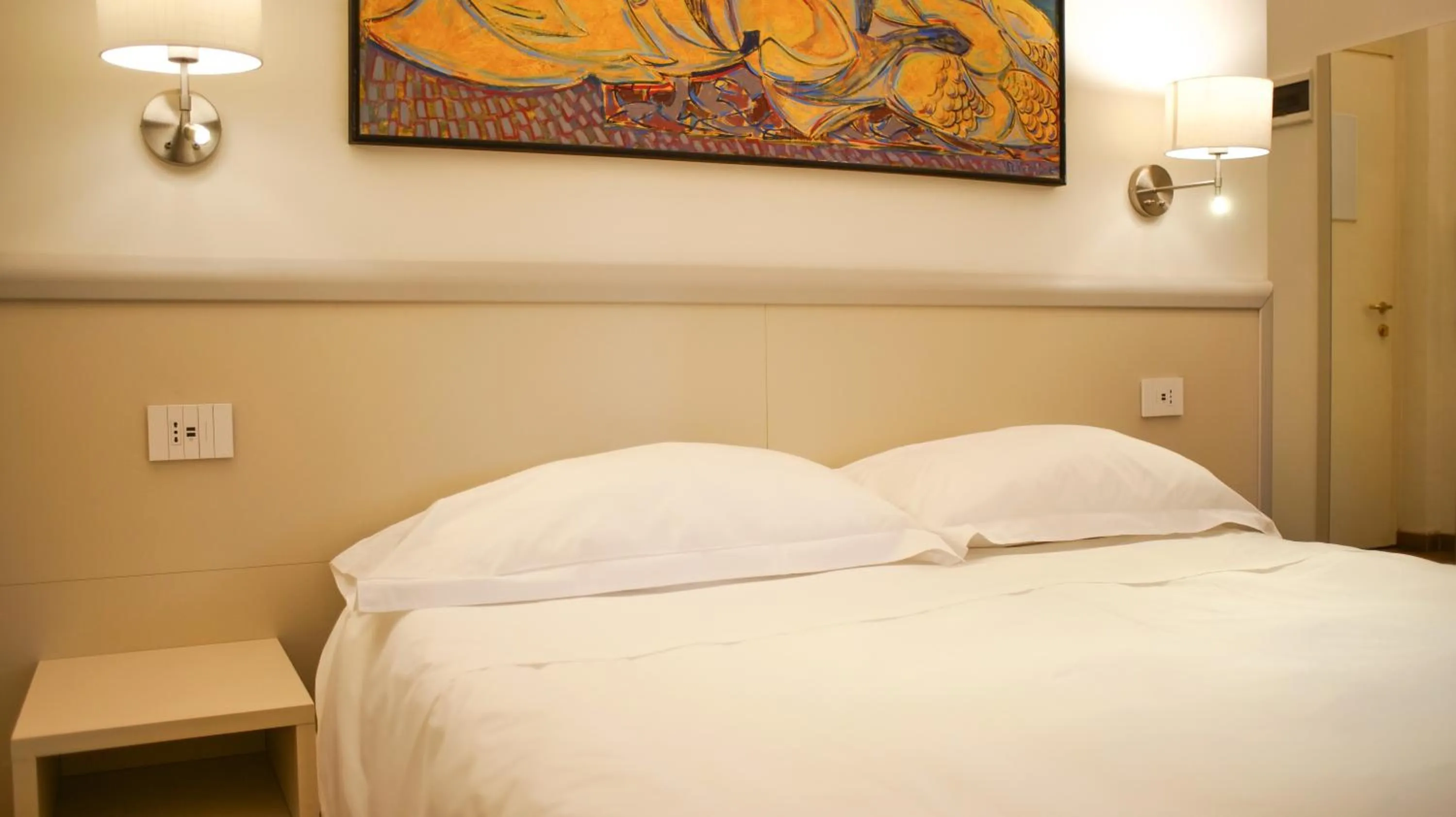 Bed in Rex Hotel Residence