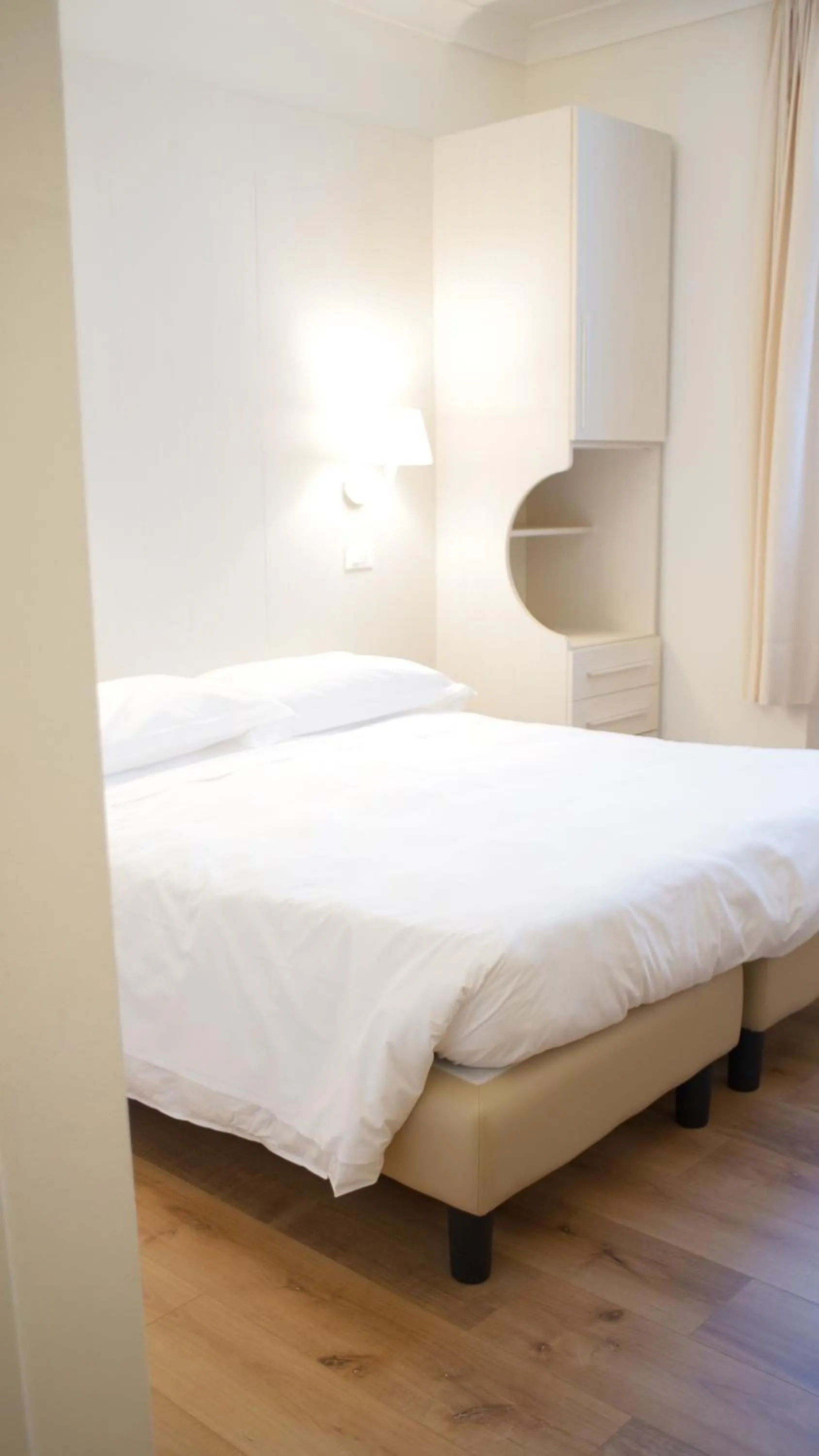 Bed in Rex Hotel Residence