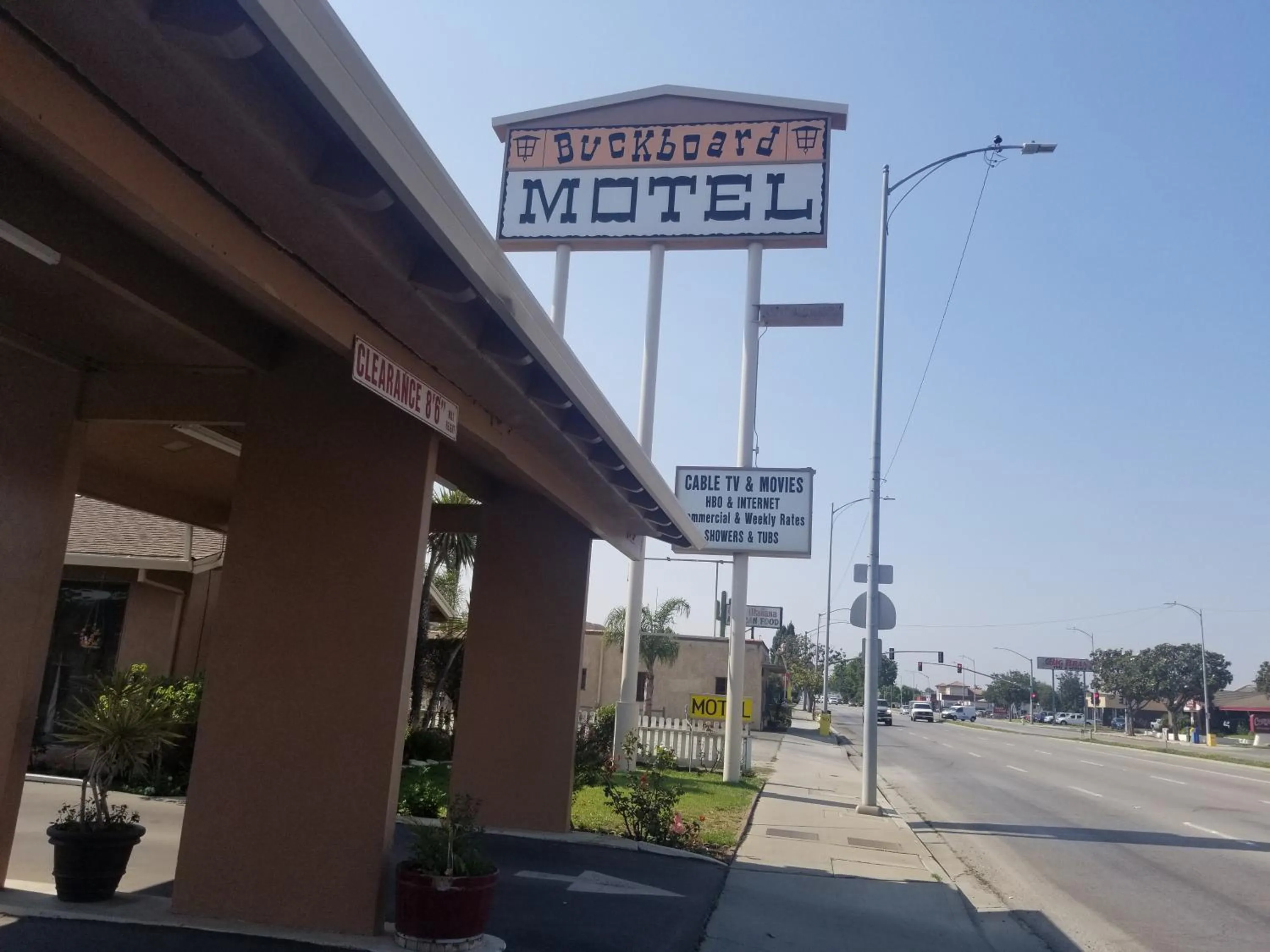 Property logo or sign in Buckboard Motel