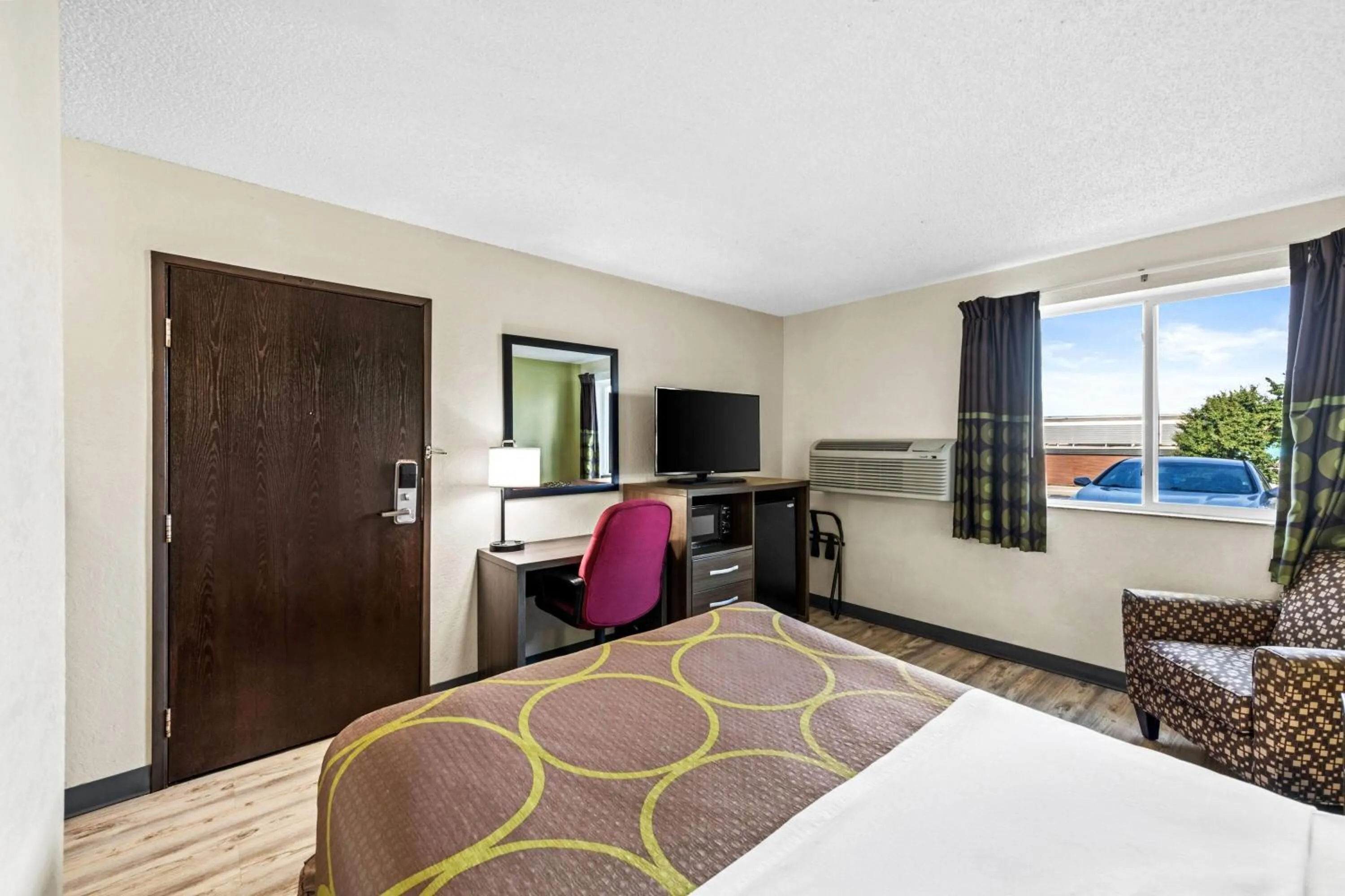 Bed in Super 8 by Wyndham Independence Kansas City