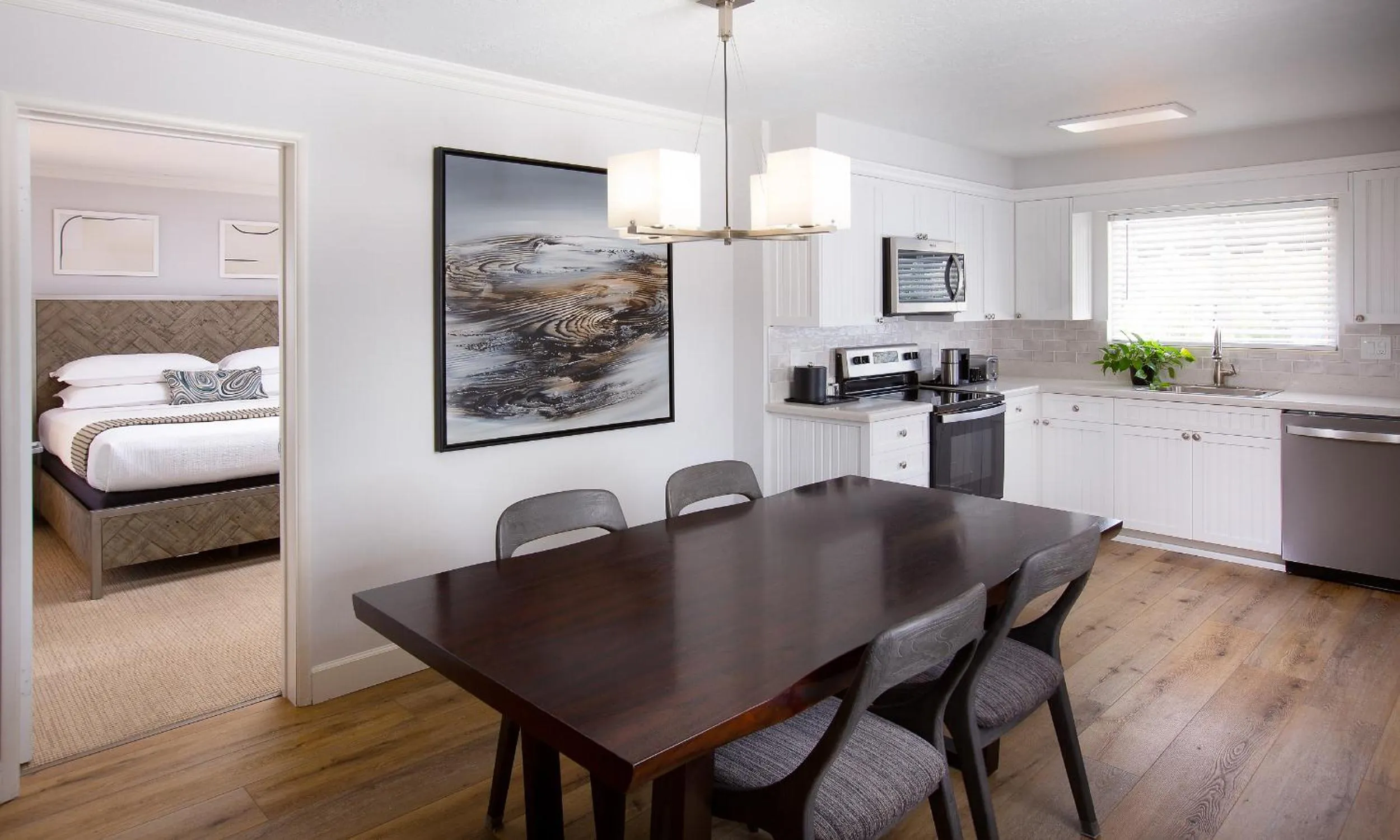 Living room, Bed in West Beach Inn, a Coast Hotel