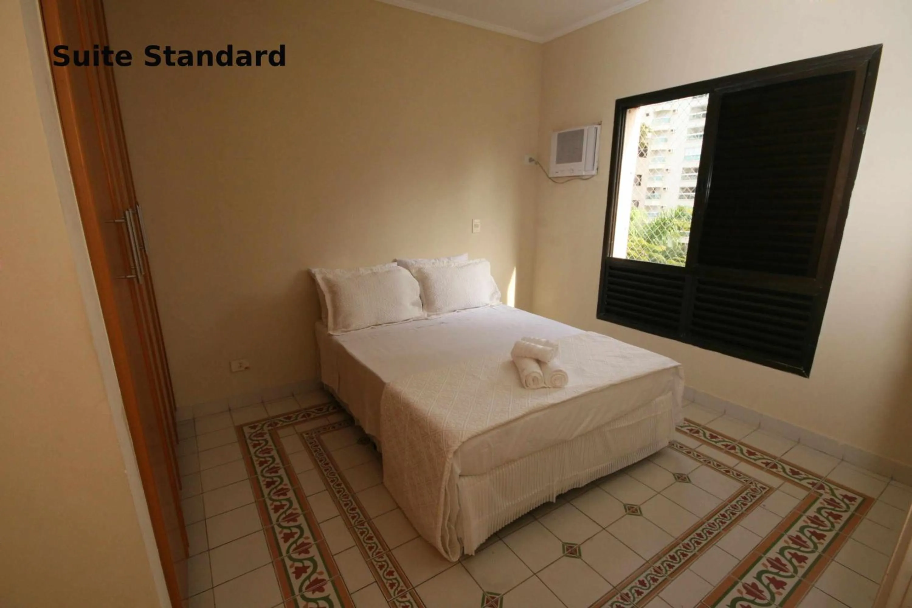 Bed in Suites Natalia Enseada