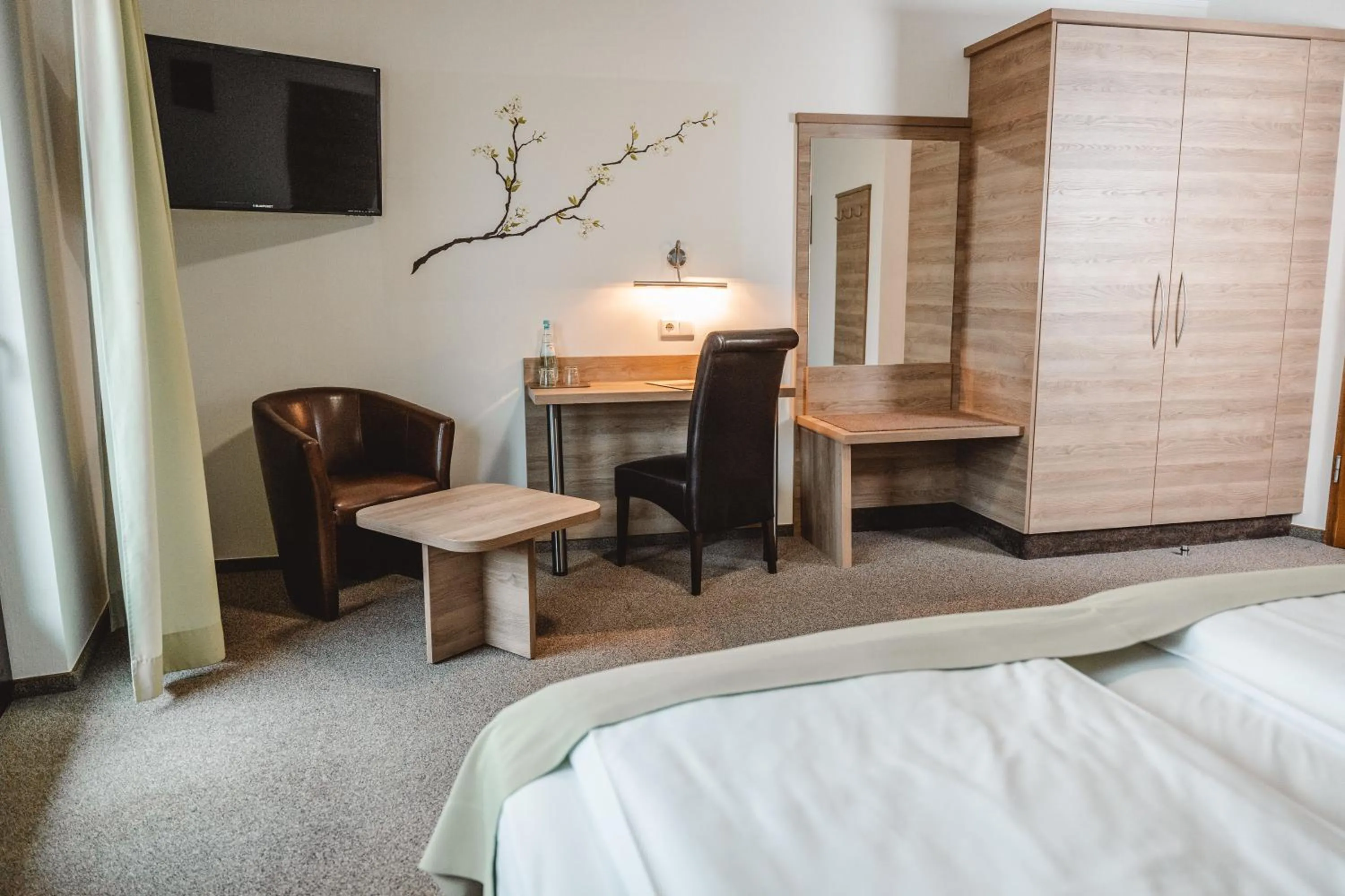 Seating area, Bed in Hotel Lellmann