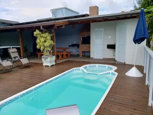 Casa de temporada com piscina Casa de temporada com piscina