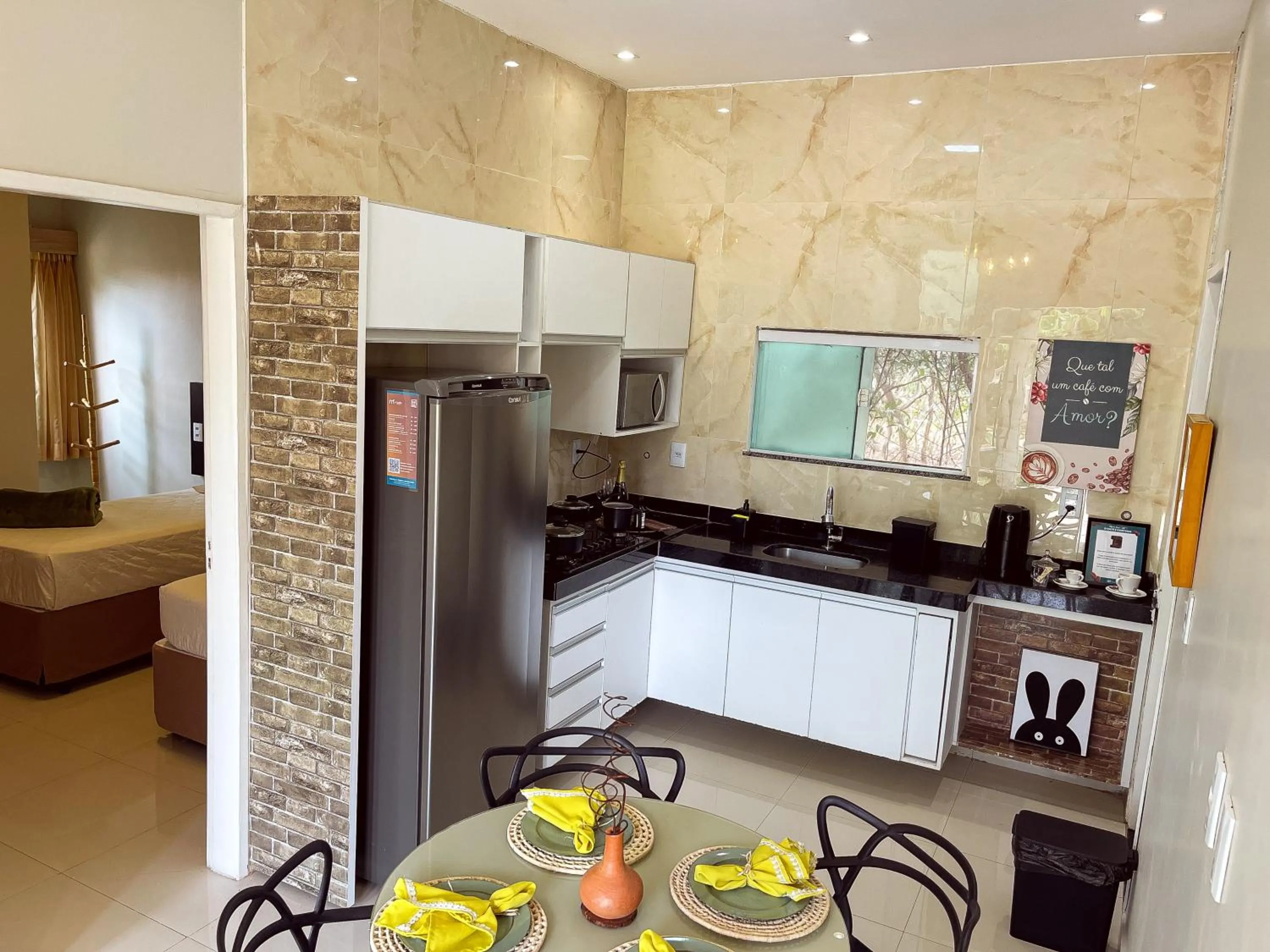 Kitchen or kitchenette in Muda Hotel