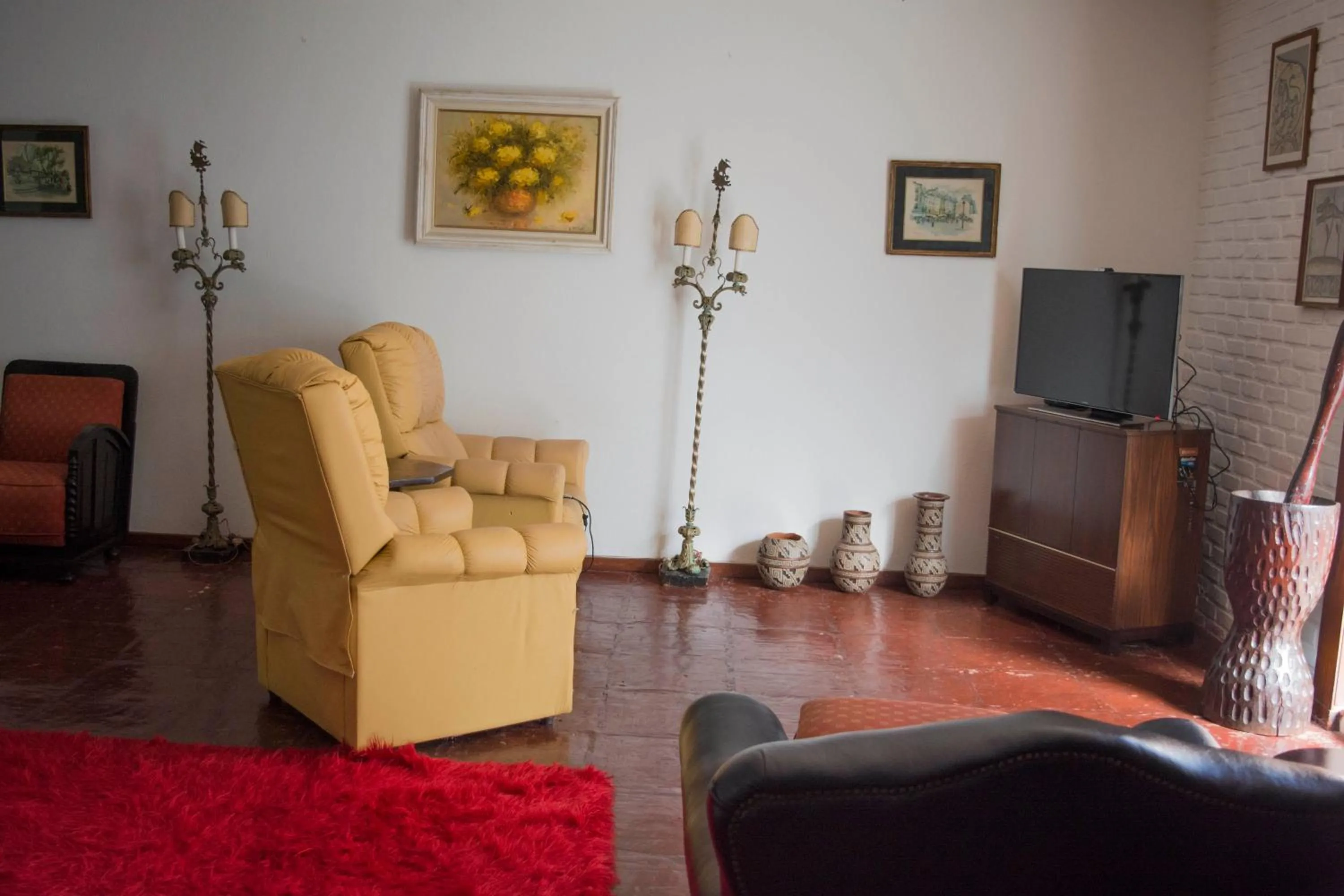 Communal lounge/ TV room in Pousada Taverna do Golf