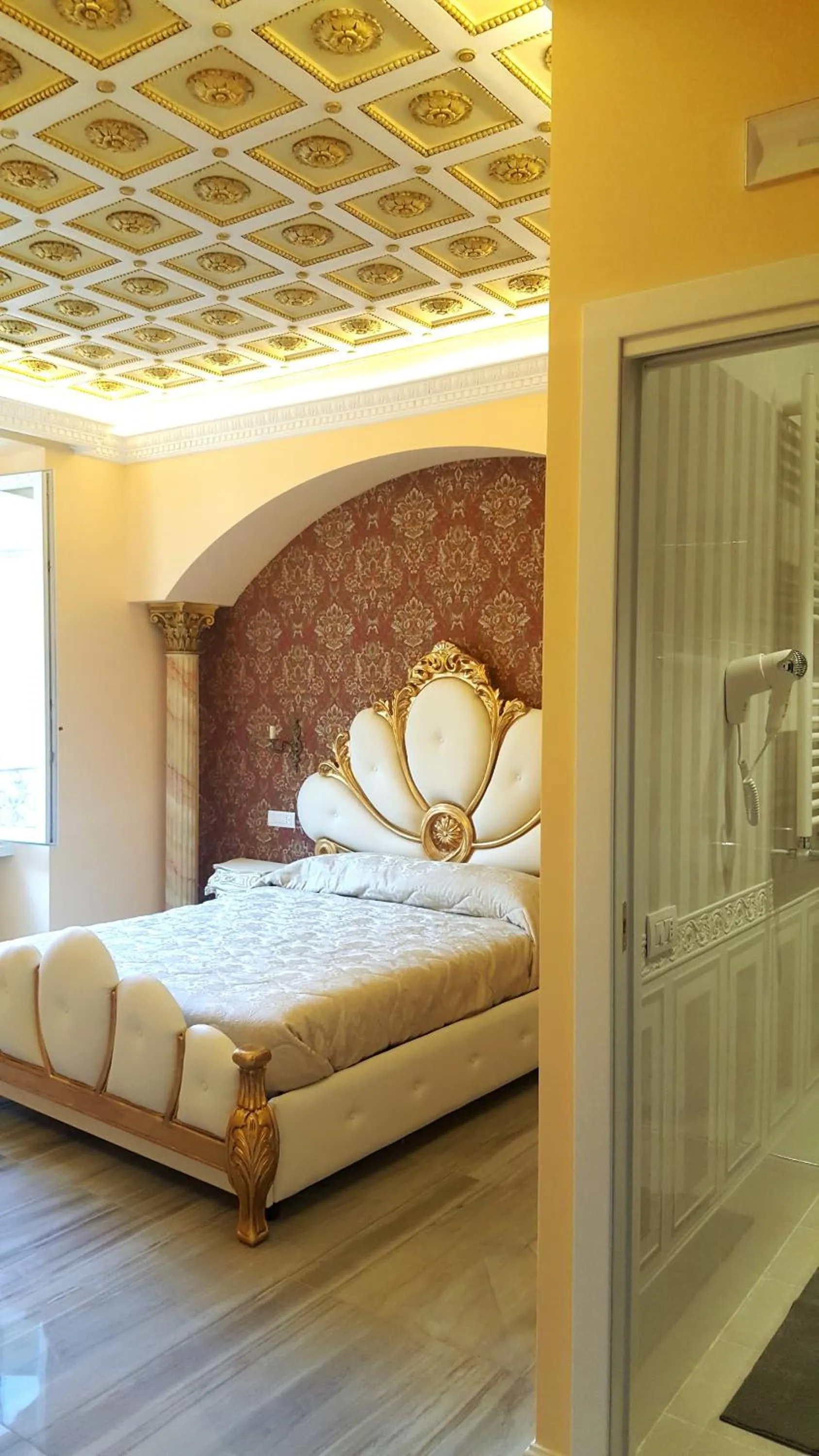 Decorative detail, Bed in Impero Vaticano Suites Guest House