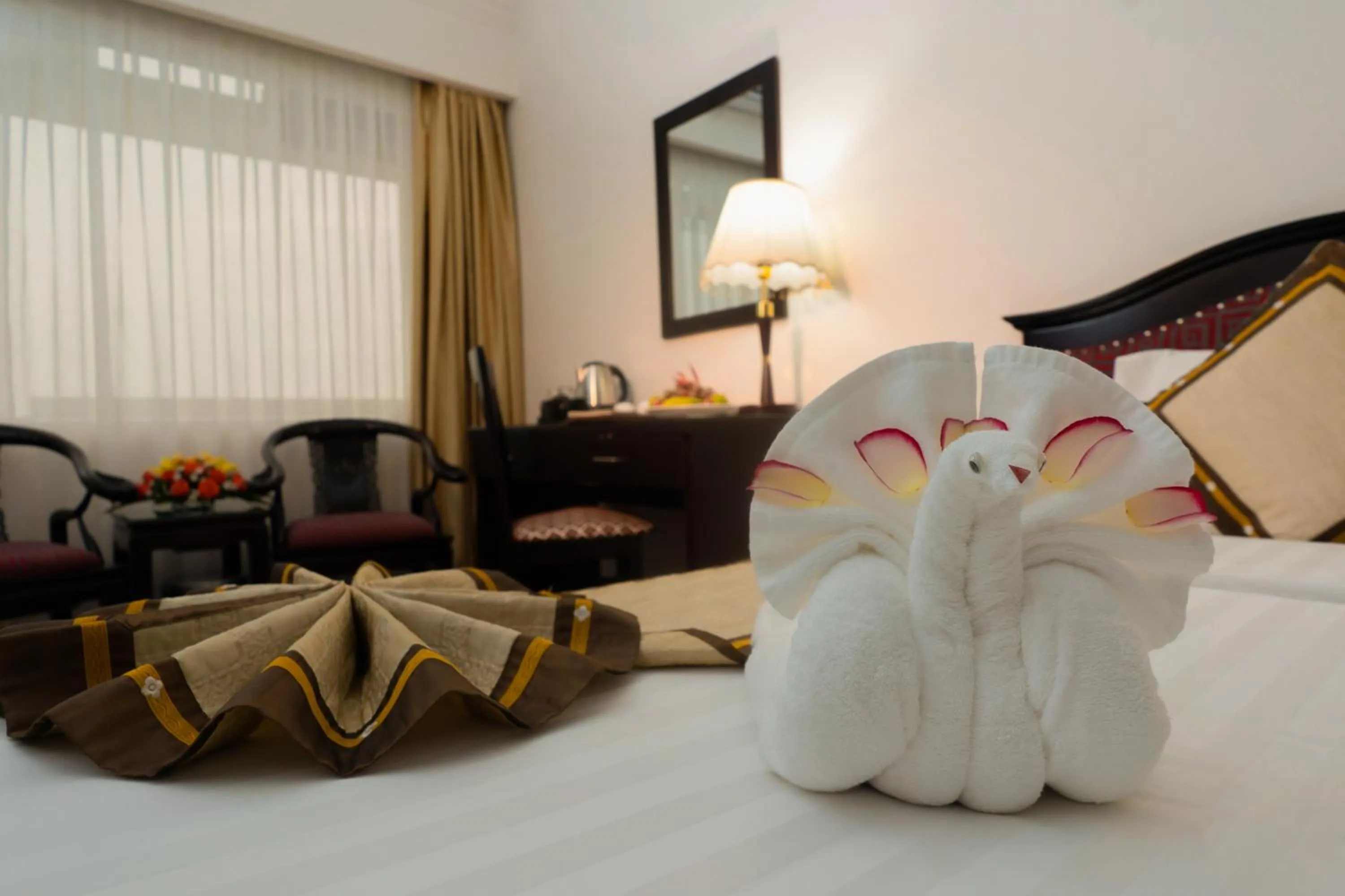 Decorative detail, Bed in Century Riverside Hotel Hue