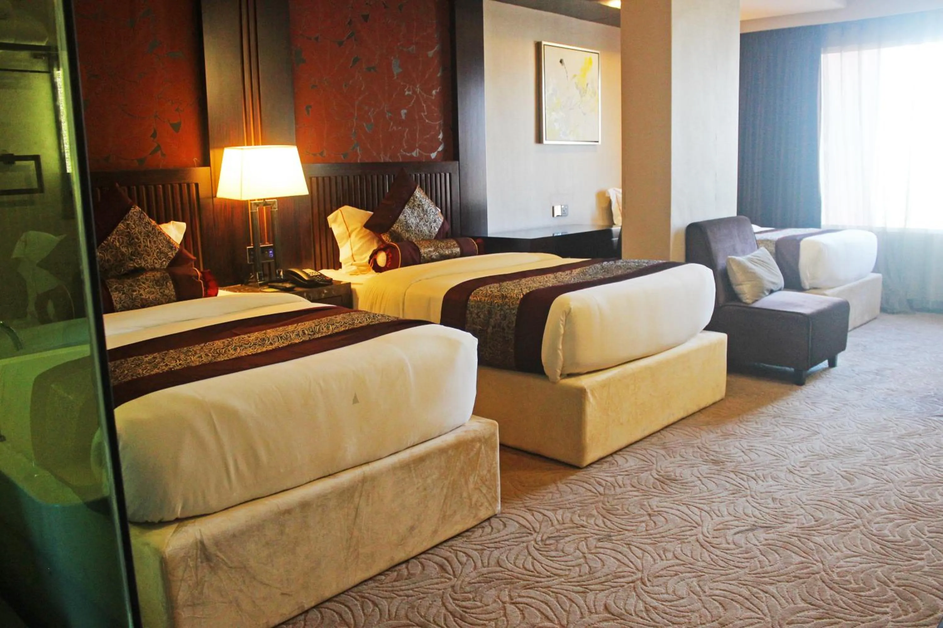 Bed in Royale Signature Hotel