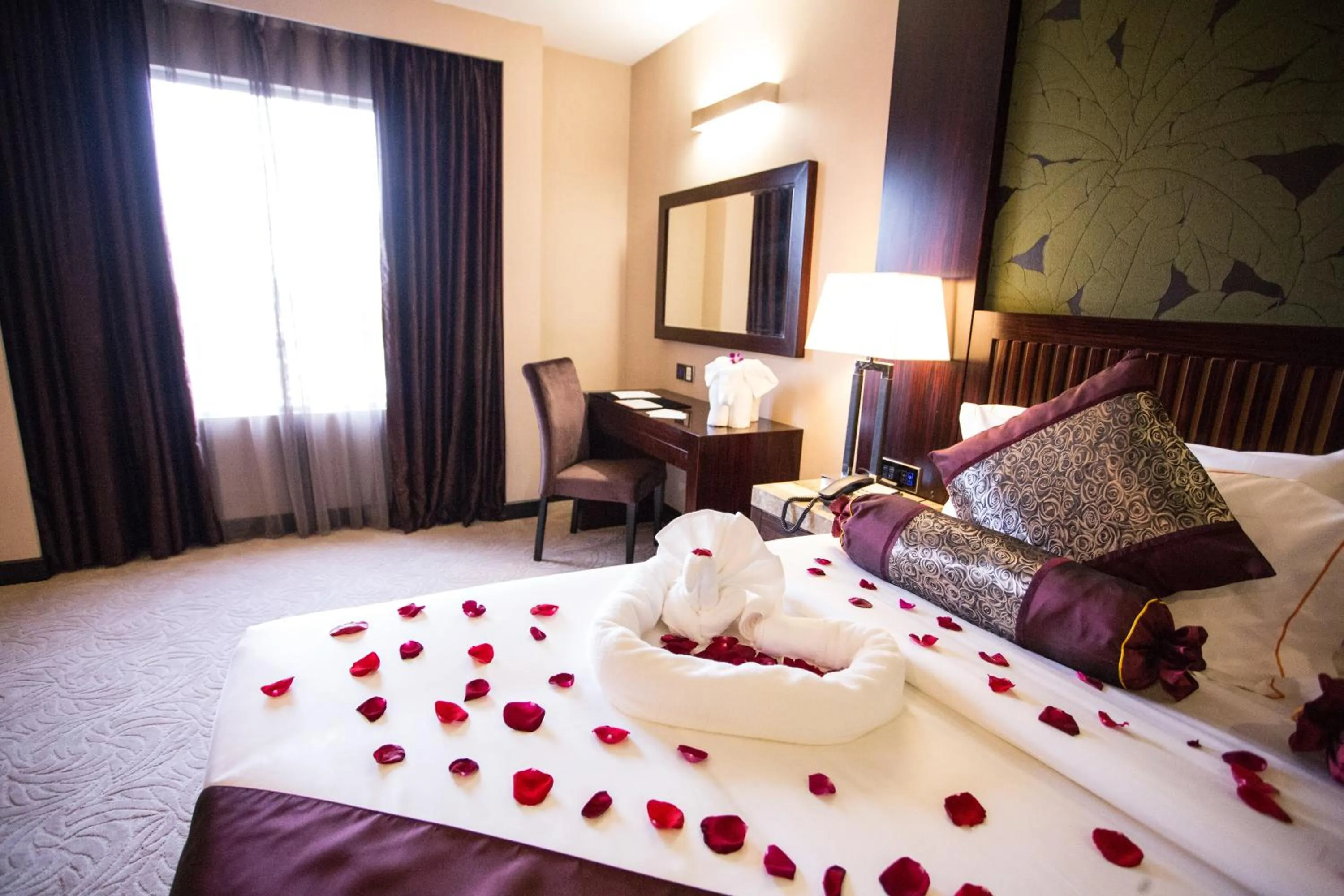 Bed in Royale Signature Hotel